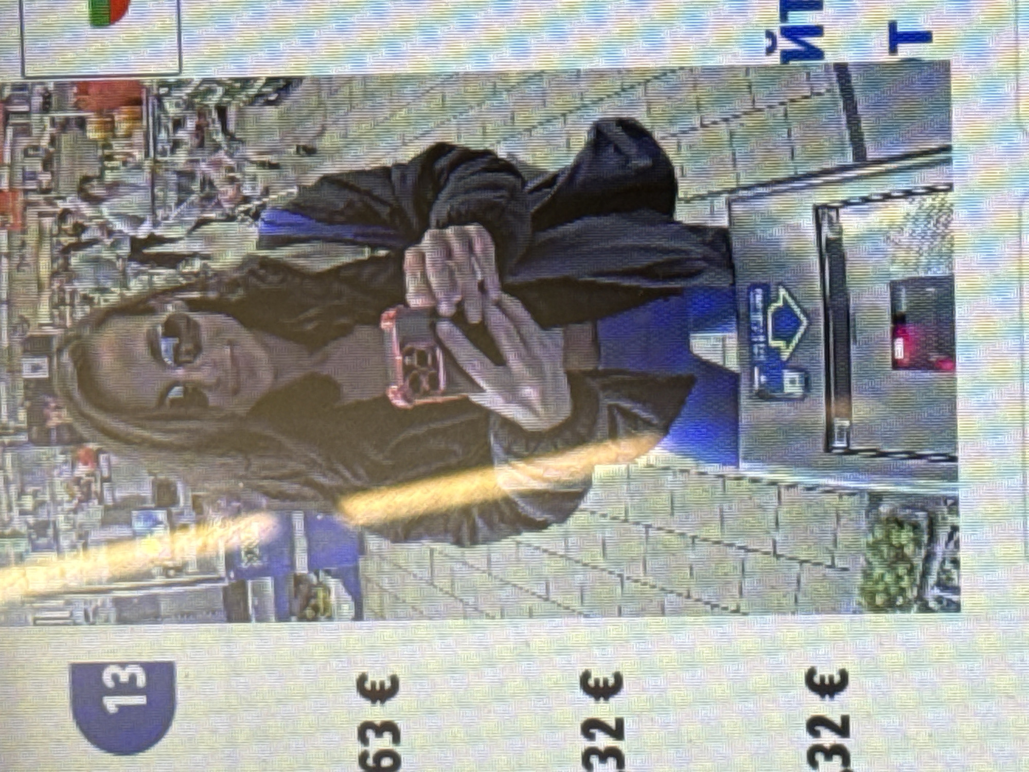 Woman takes selfie near vending machine in Pleven, Bulgaria
