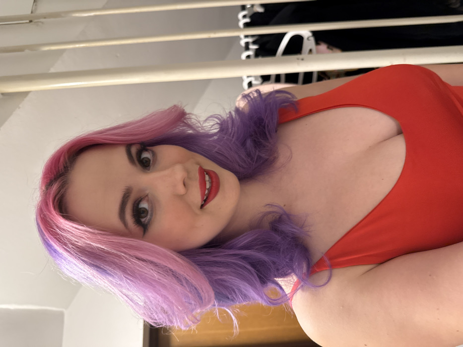 Woman with colorful hair documents afternoon in Zagreb selfies