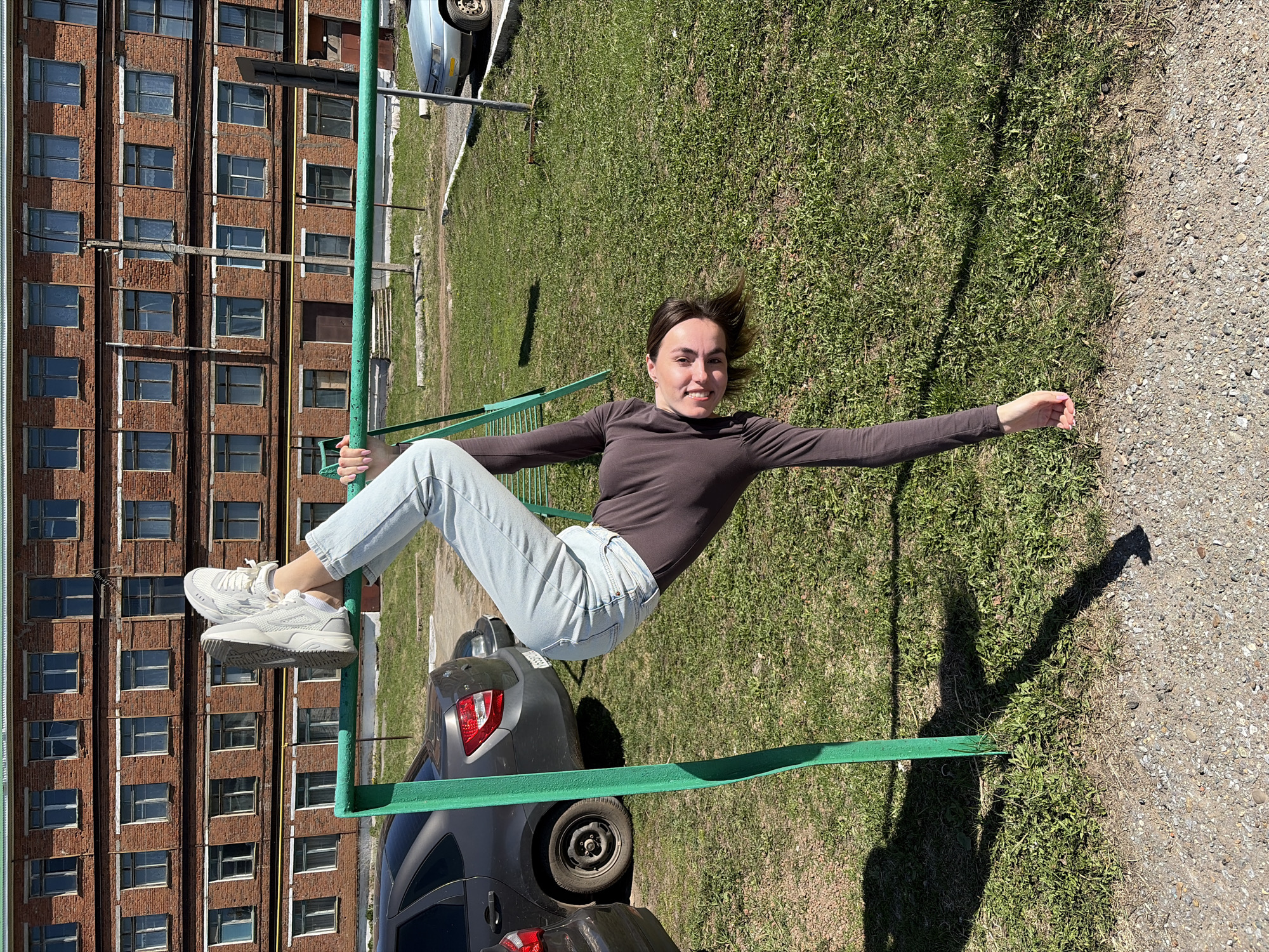 Adults use playground equipment in Neftekamsk, Russia