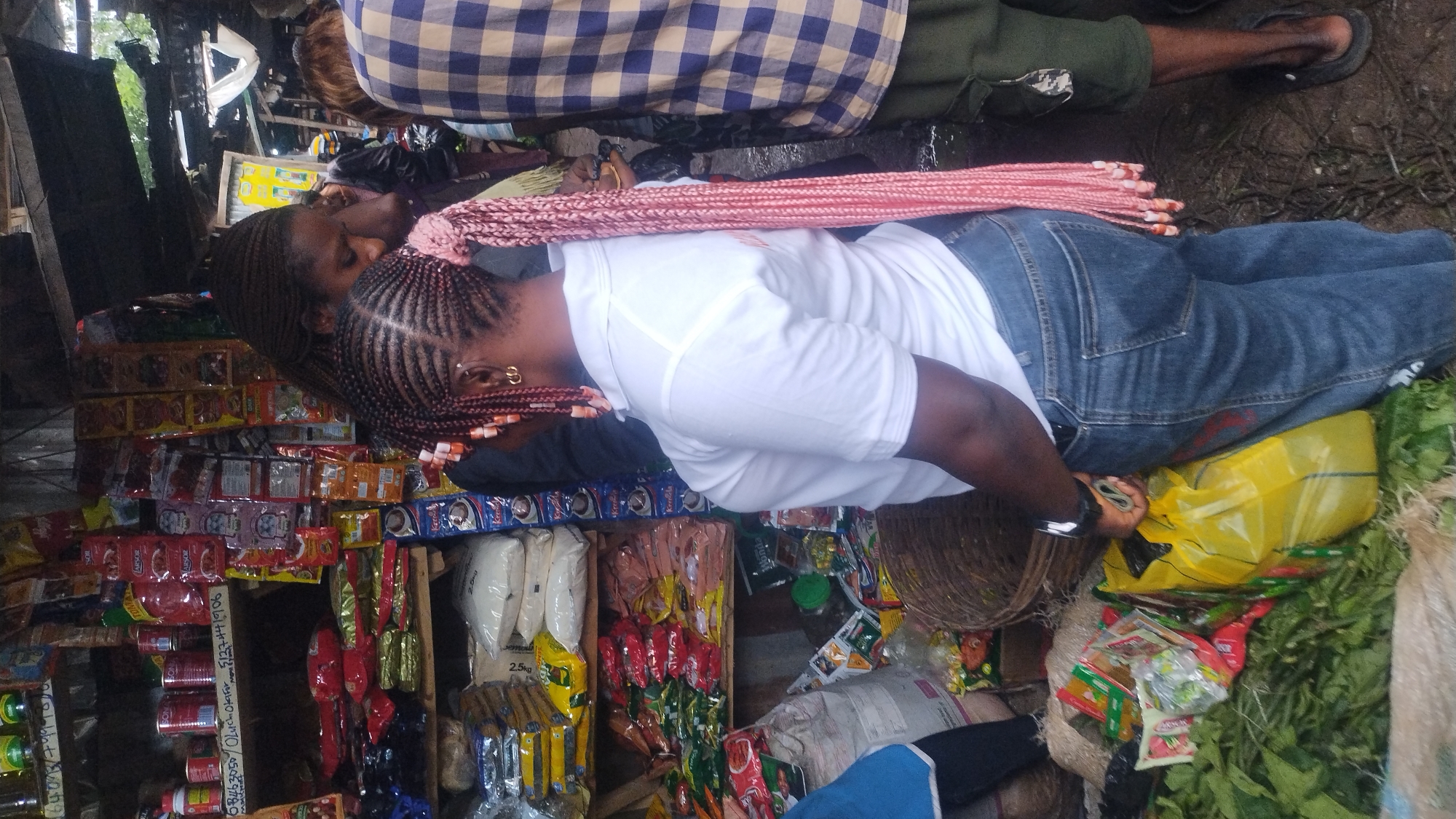 Afternoon street market life in a West African urban setting
