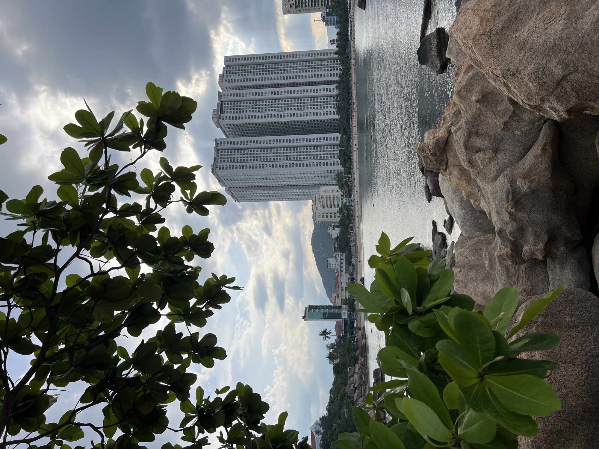 Nha Trang's rocky coast and city streets on a June morning