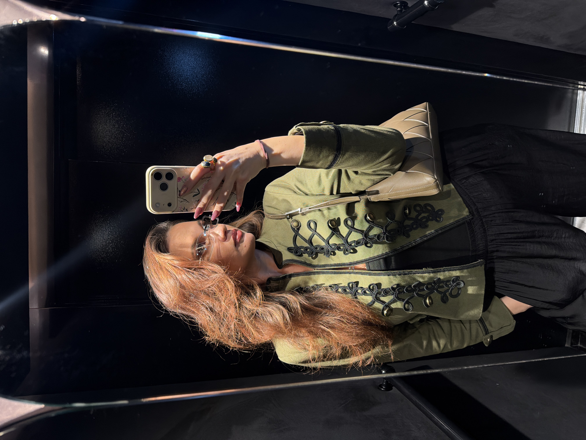 Woman takes mirror selfie in Athens