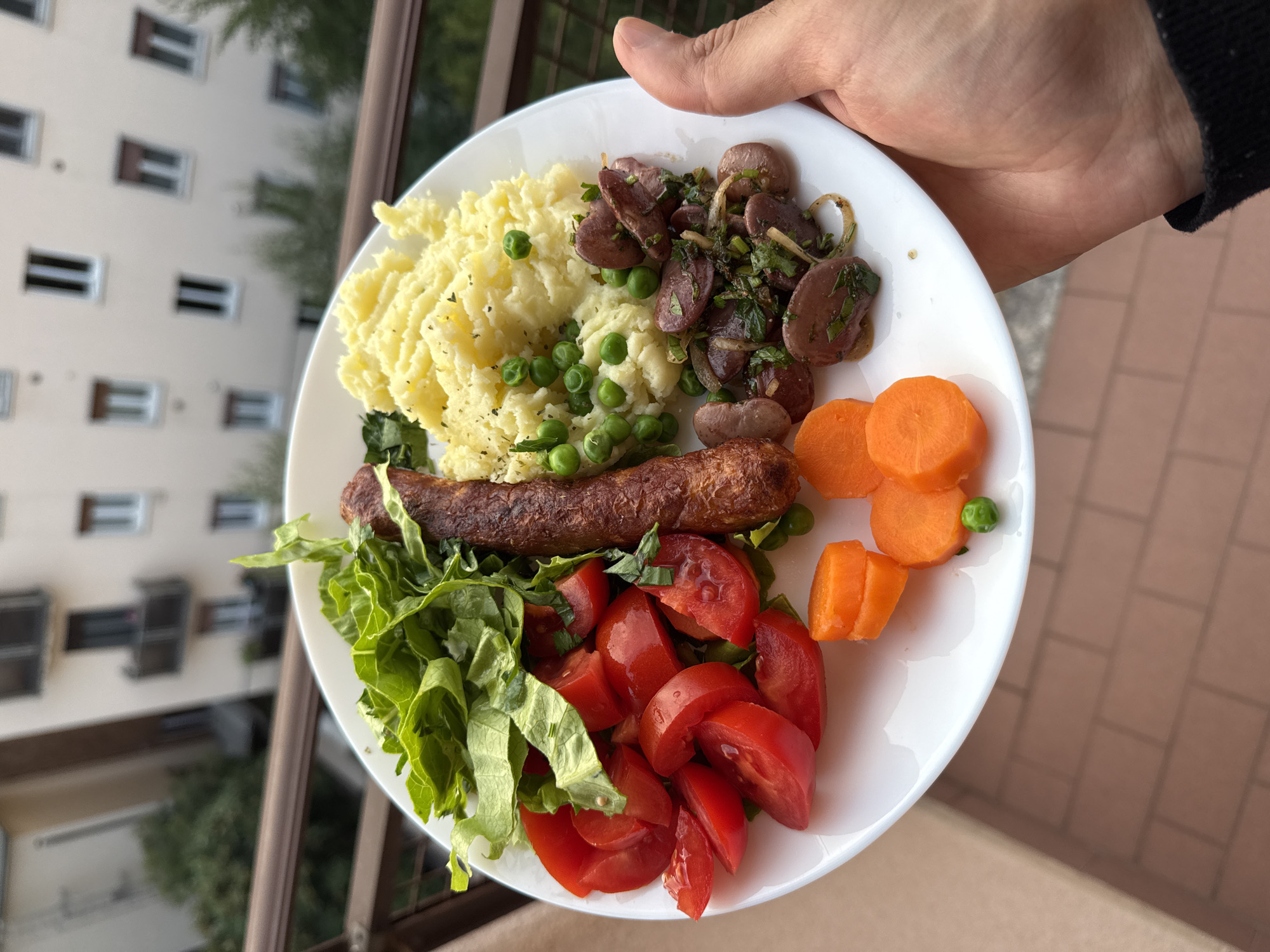 Dinner plate photographed against Milan cityscape backdrop