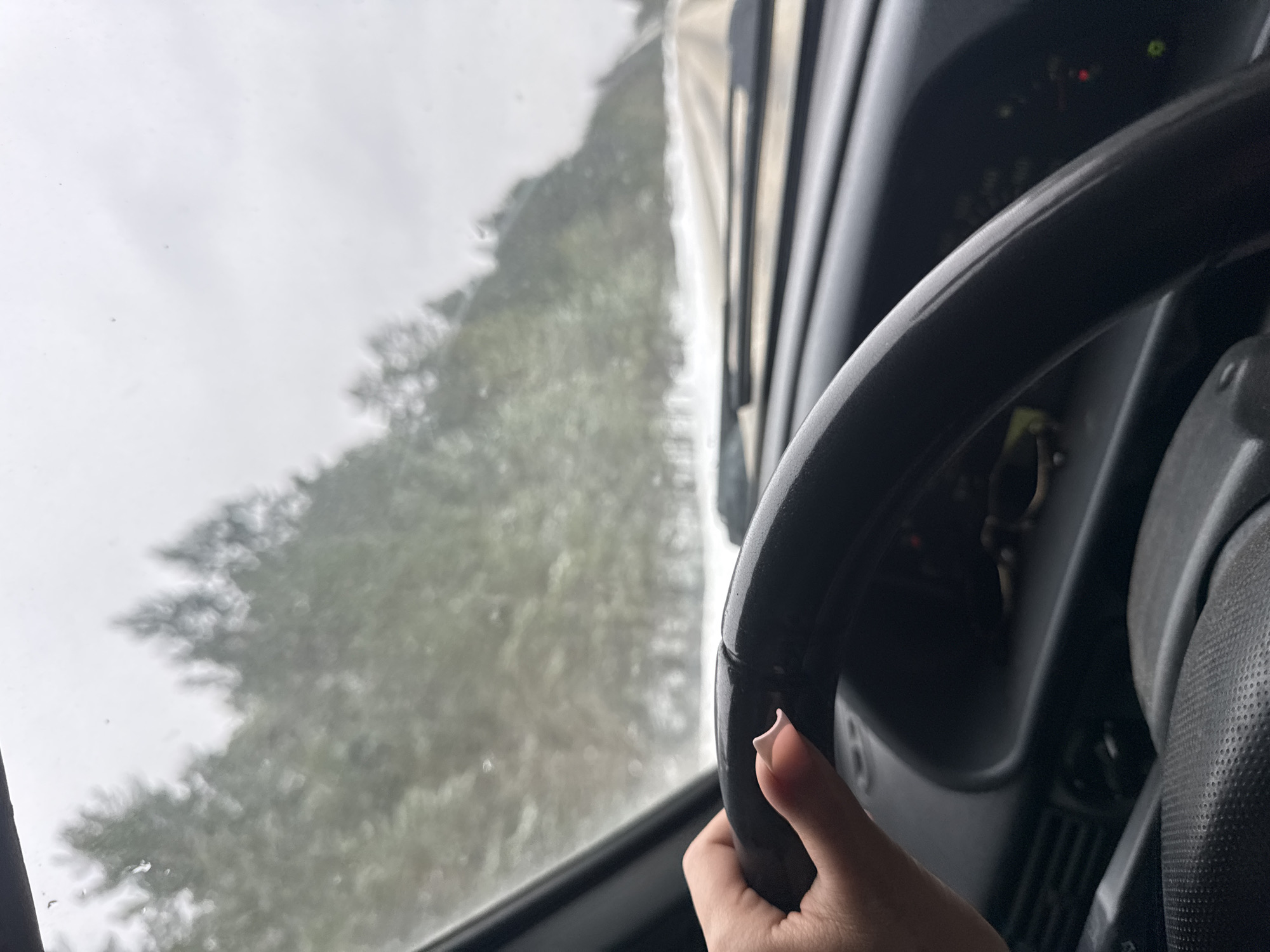 Driver navigates rainy conditions in Chaikovsky, Russia