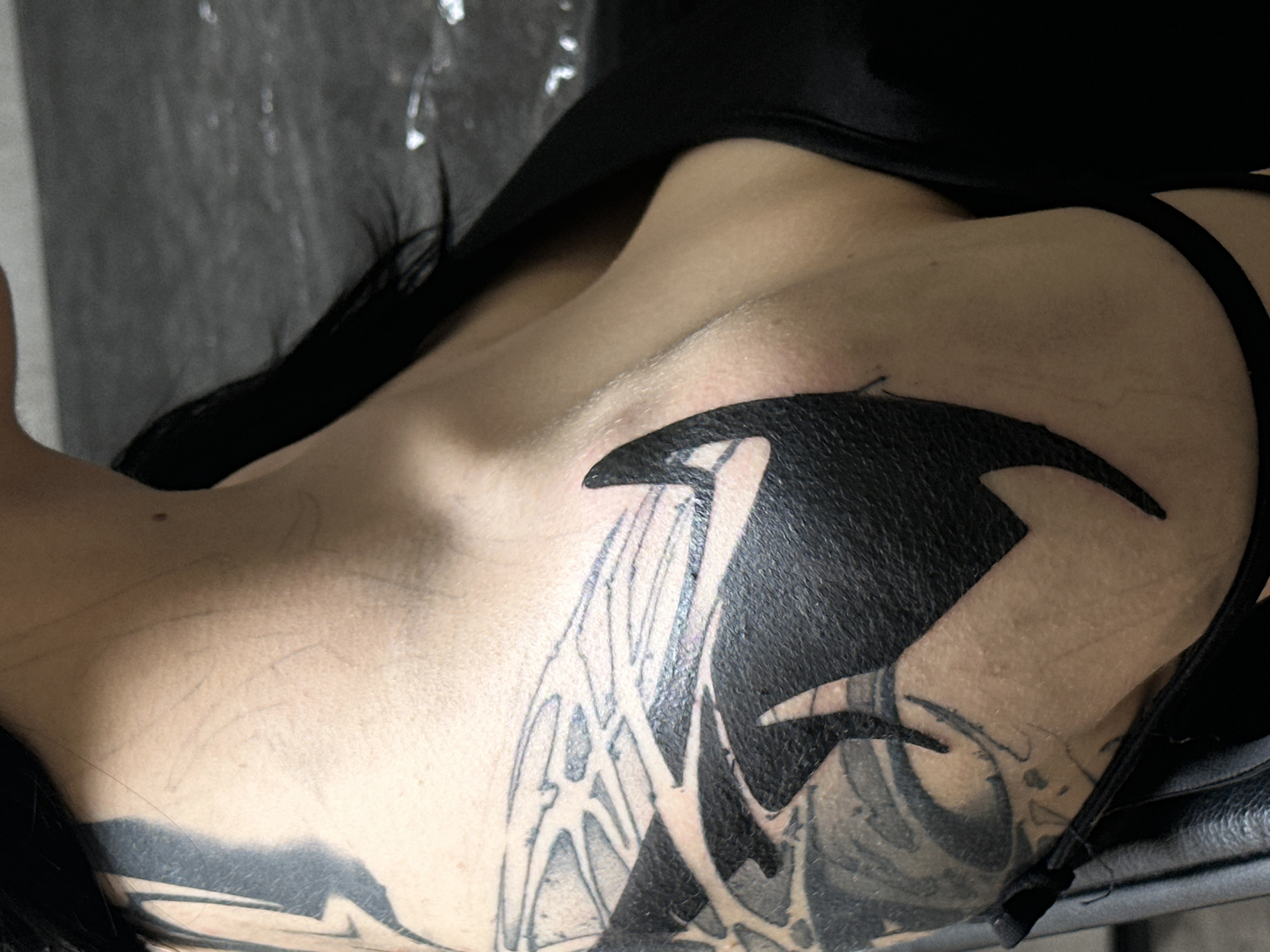Person displays large orca whale tattoo in Moscow