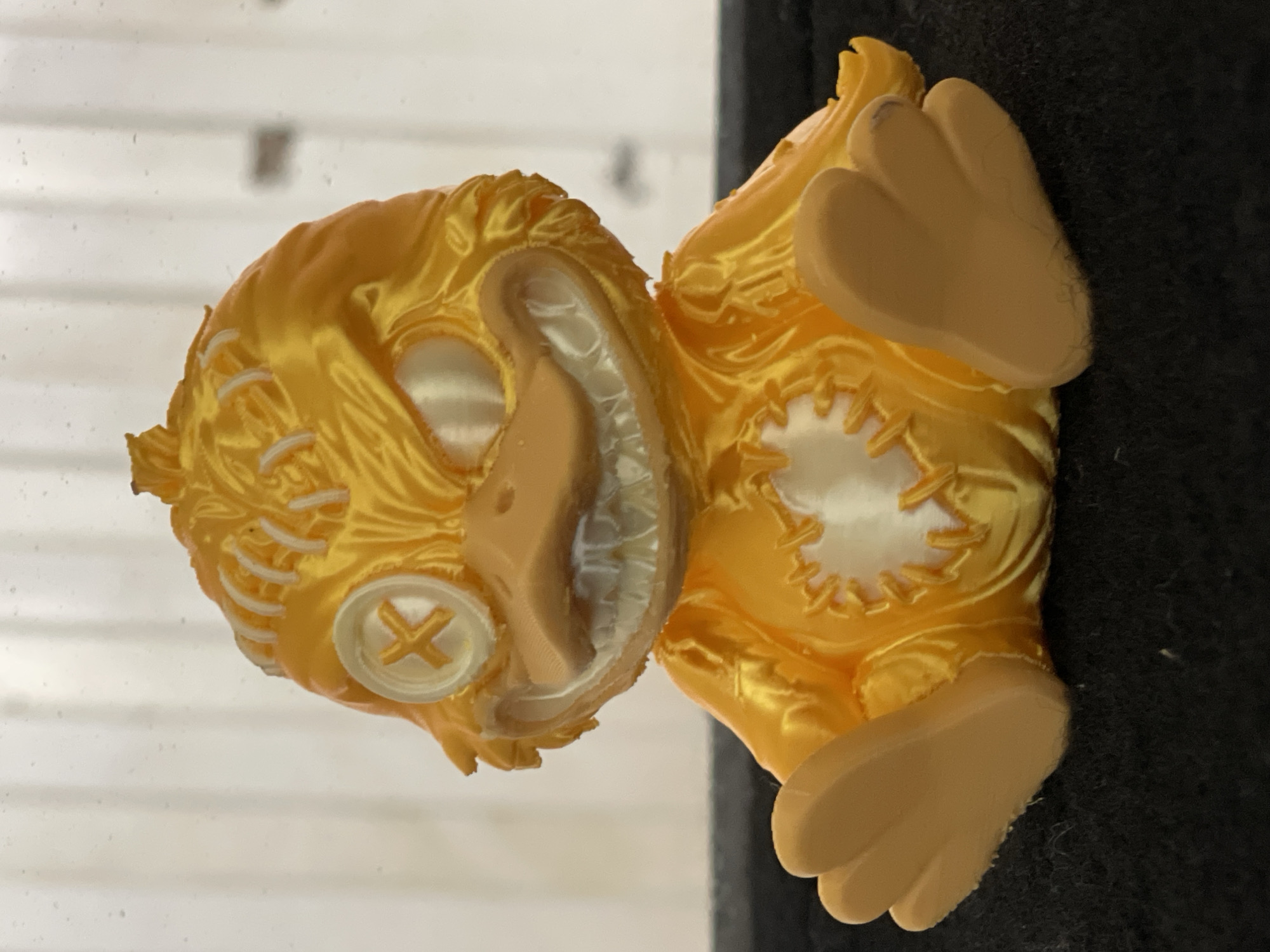 Yellow stitched bird figurine documented in Zelenograd studio shots