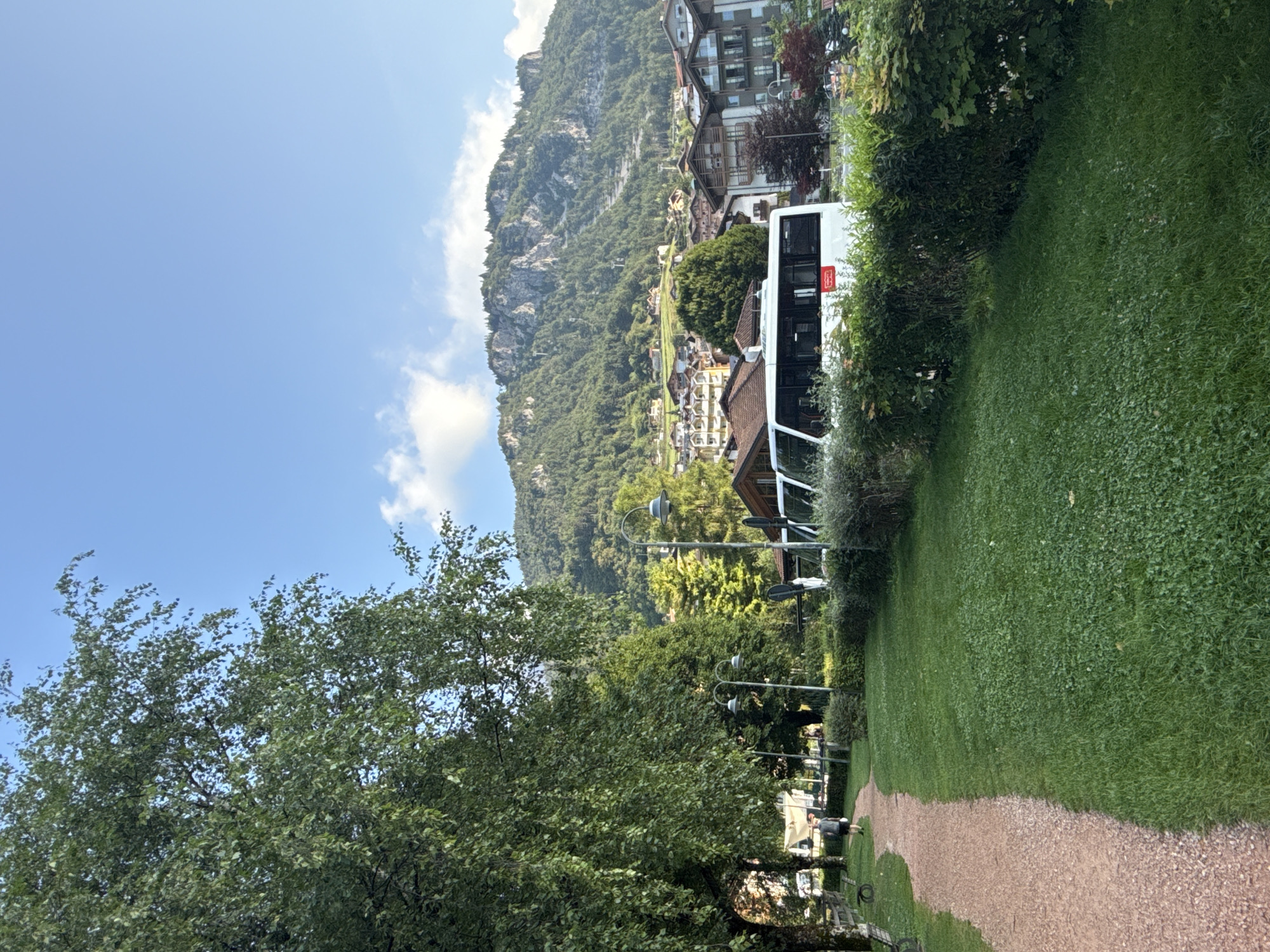 Buses, mountain views, and a lunch tent in Molveno
