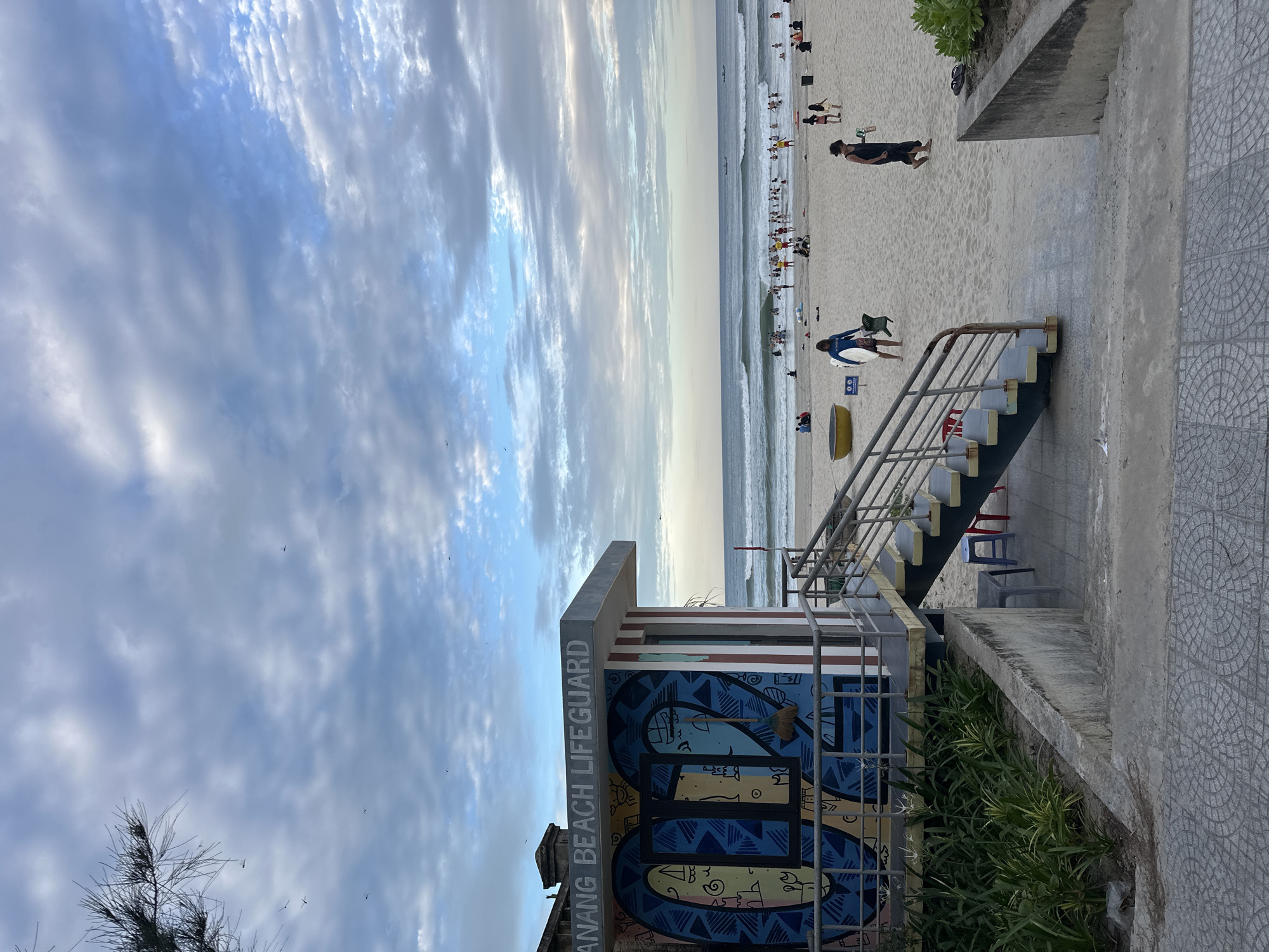 Golden hour at My Khe Beach, Da Nang's graffiti lifeguard station
