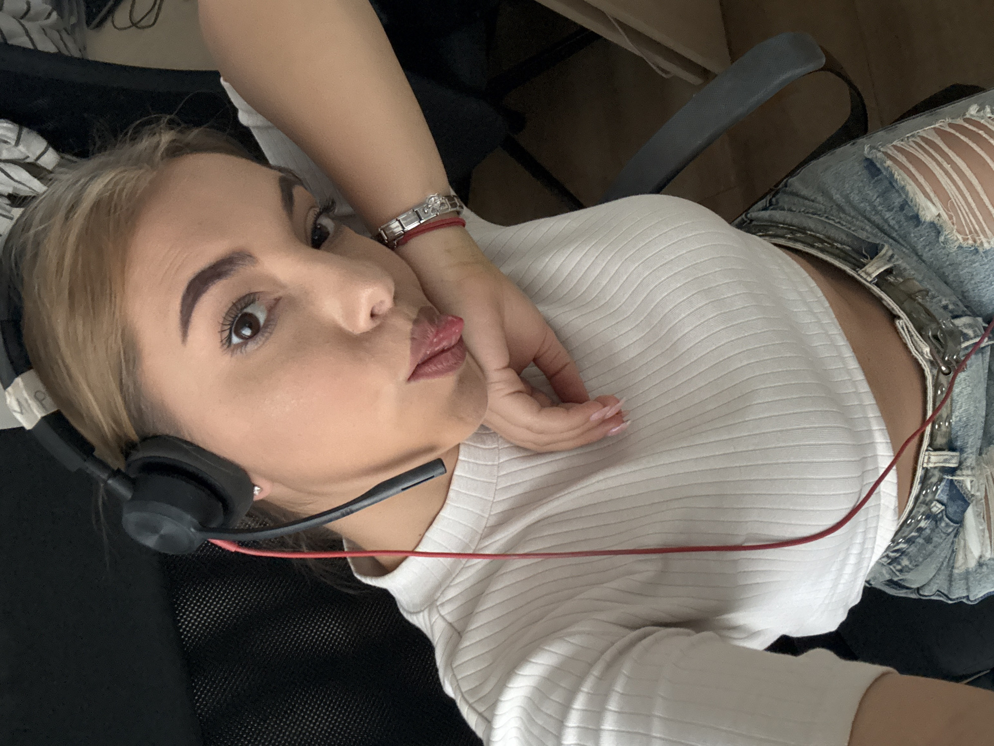 Woman Takes Multiple Selfies During Office Photo Session