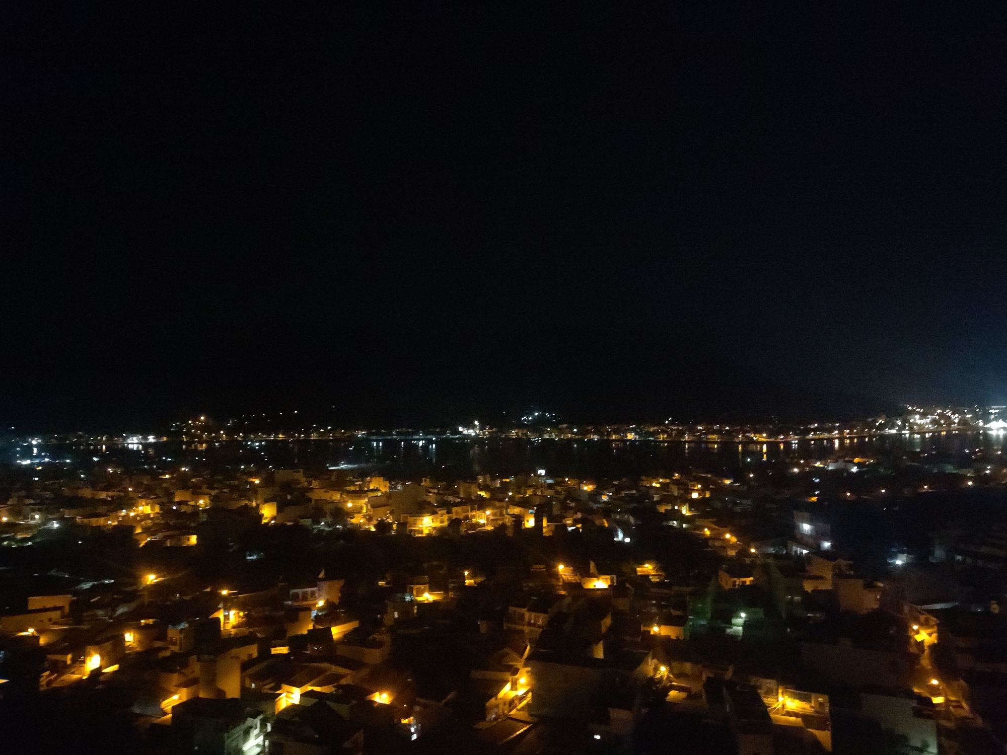 Nighttime aerial view captures illuminated Nha Trang Ward coastline