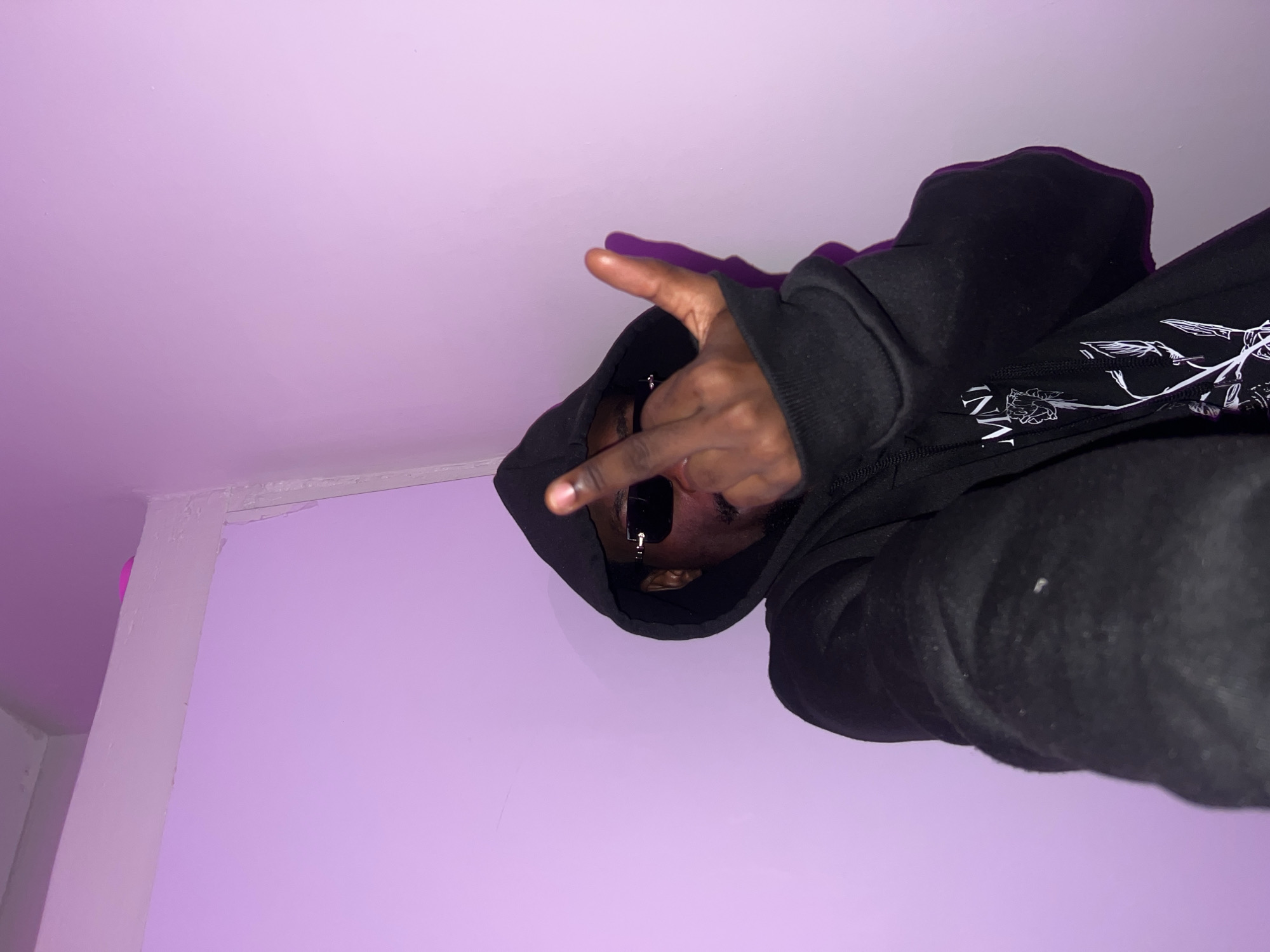 Hooded figure photographed making gestures in Lagos residence