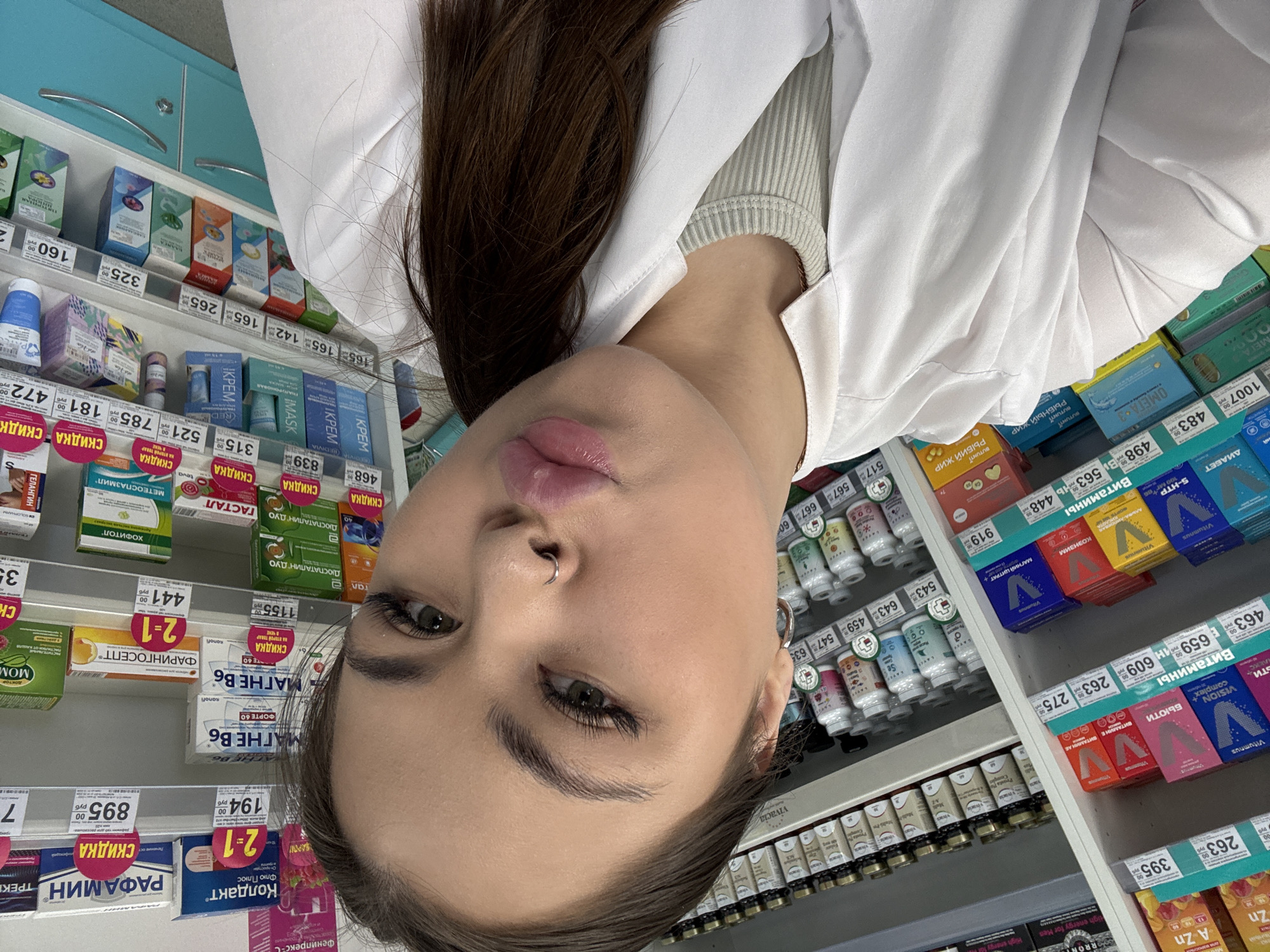 Woman takes selfie in Russian pharmacy