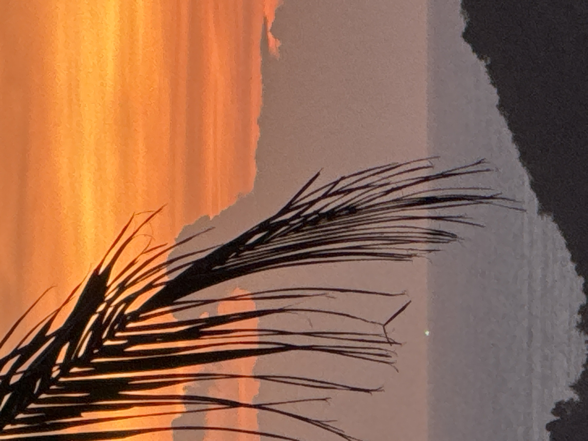 Tropical sunset captured over Thai coast and mountains