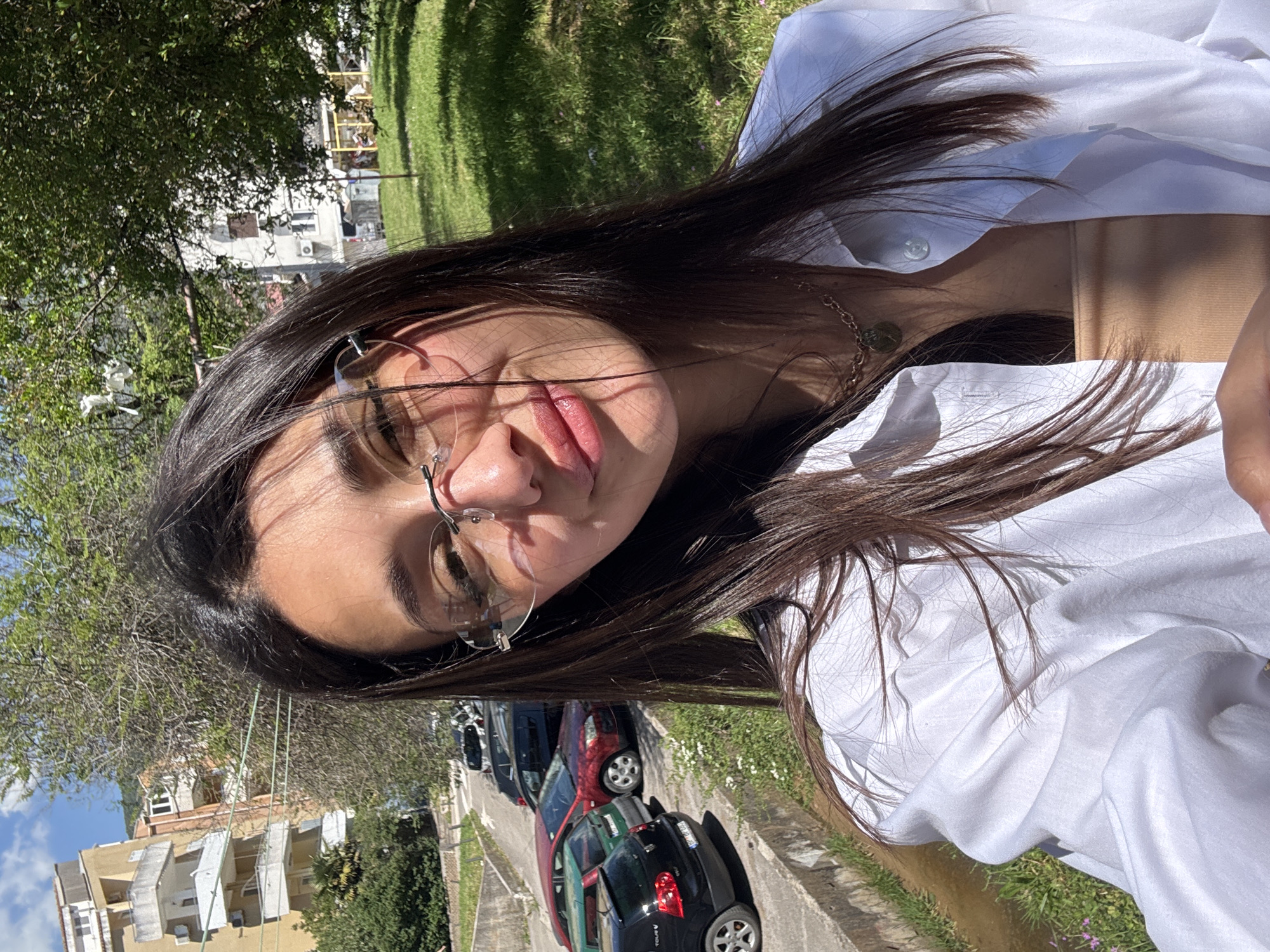 Woman takes selfie on street in Budva, Montenegro