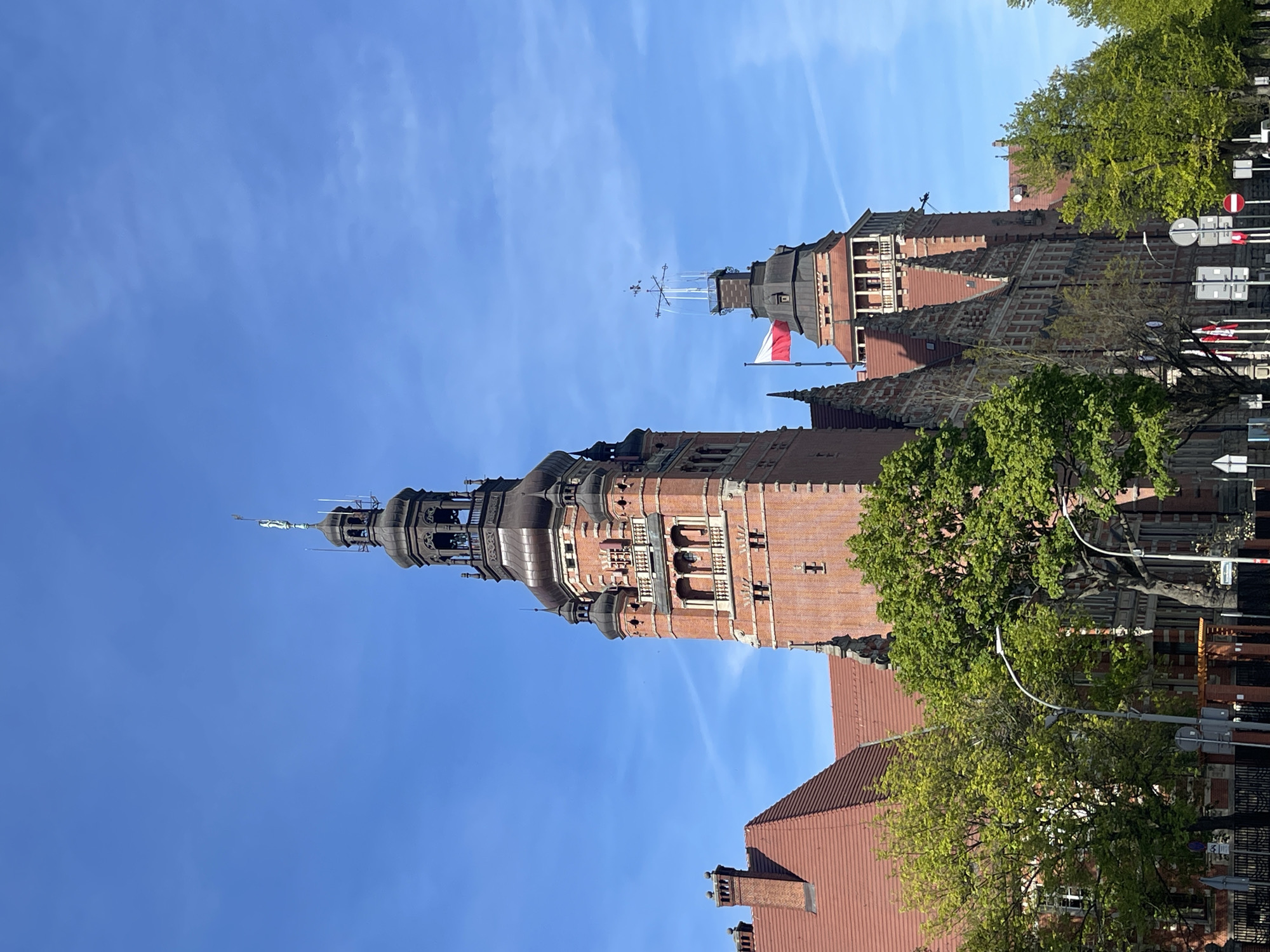 Sunny afternoon street life documented around historic Szczecin architecture