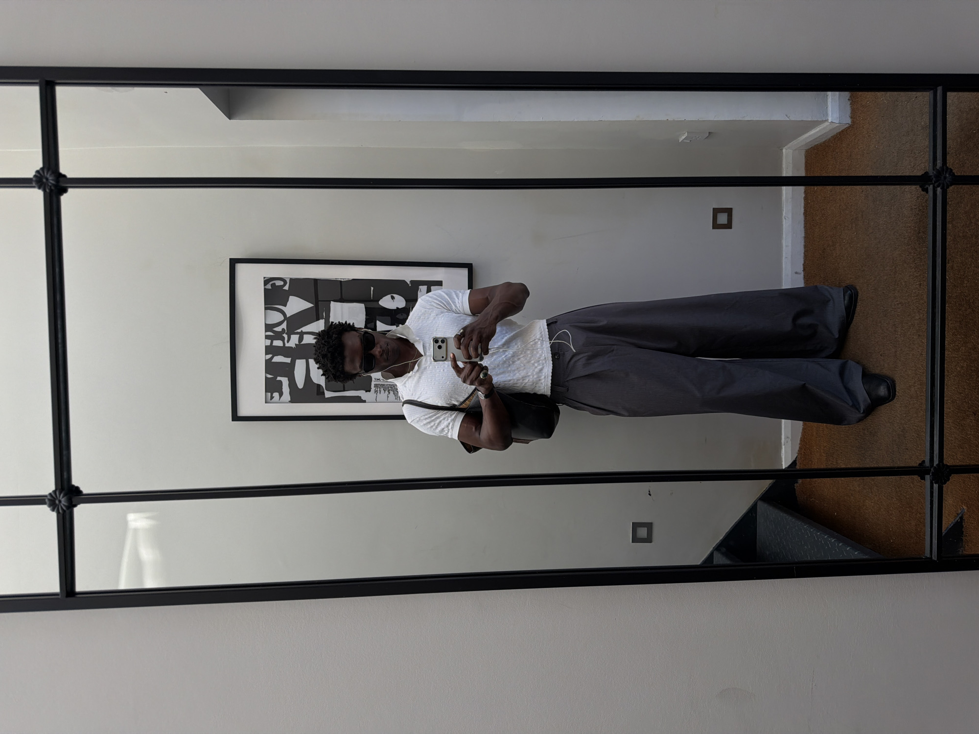 Hallway mirror selfie, sharp casual outfit in London