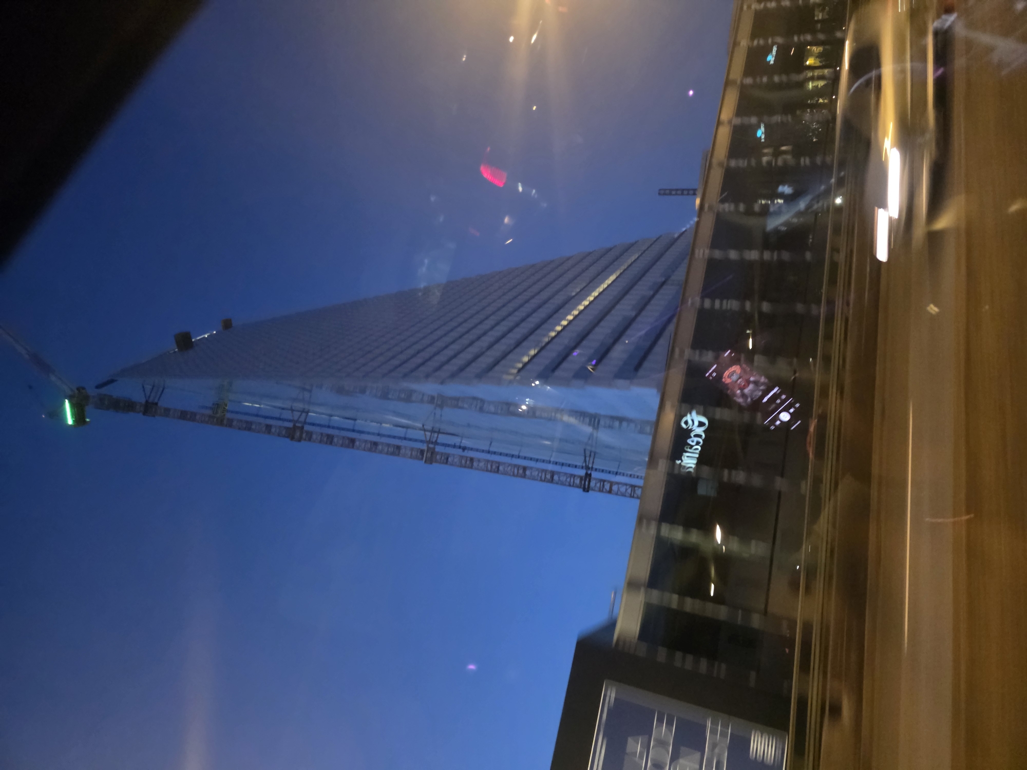 Glass tower rising in Issy-les-Moulineaux under night construction lights