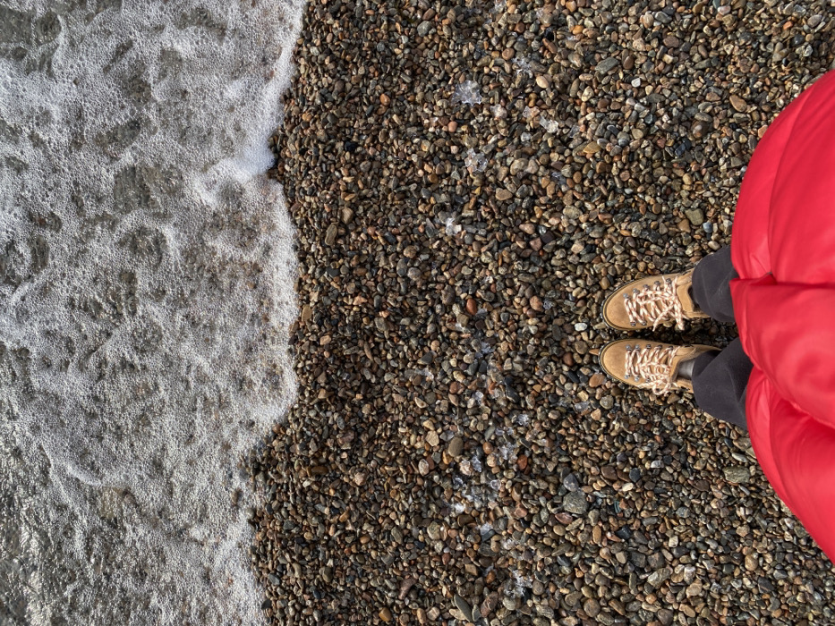 Winter visitor explores icy Lake Baikal shore in Listvyanka