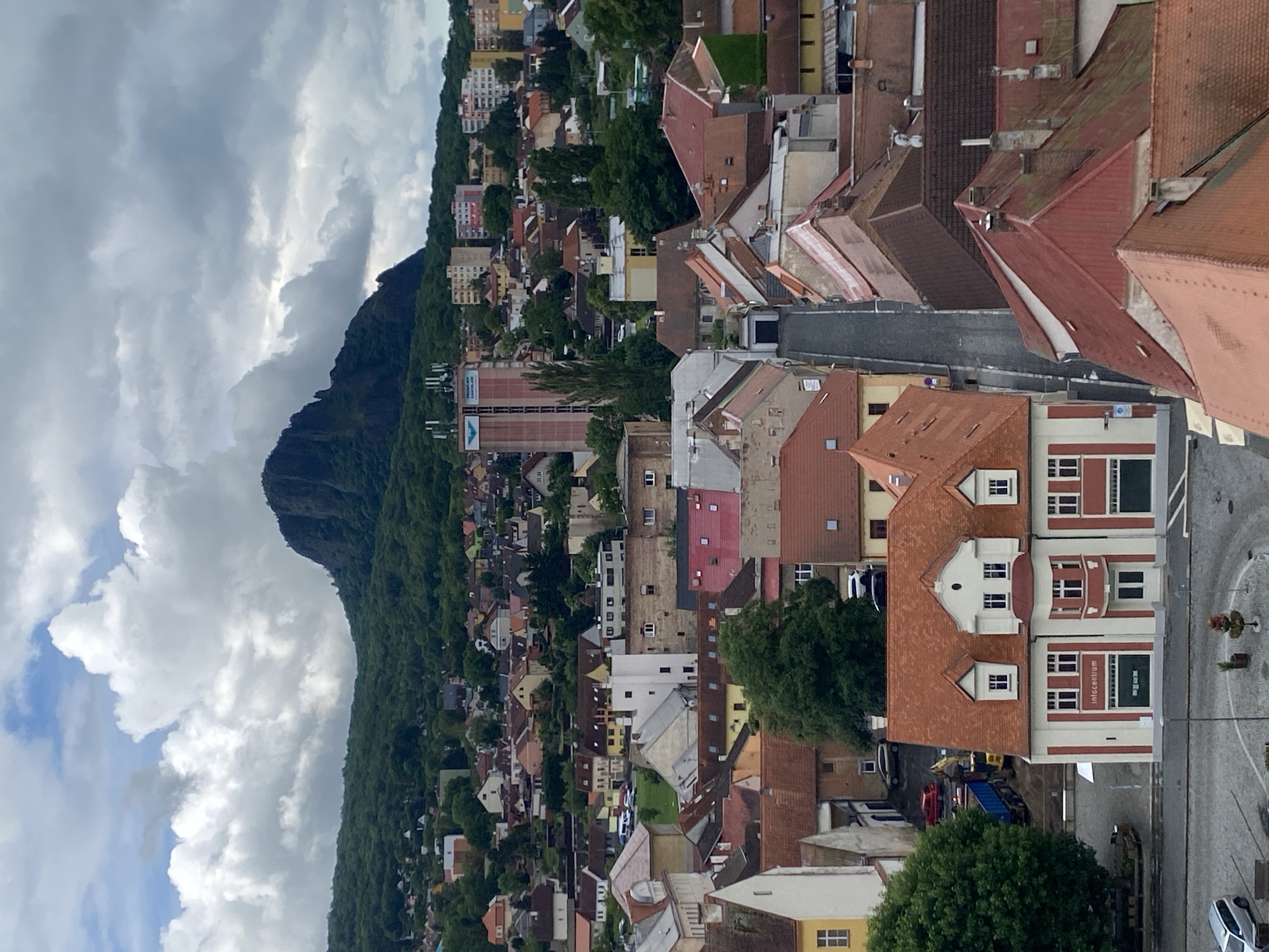 Aerial views document Bílina, Czechia cityscape on cloudy morning