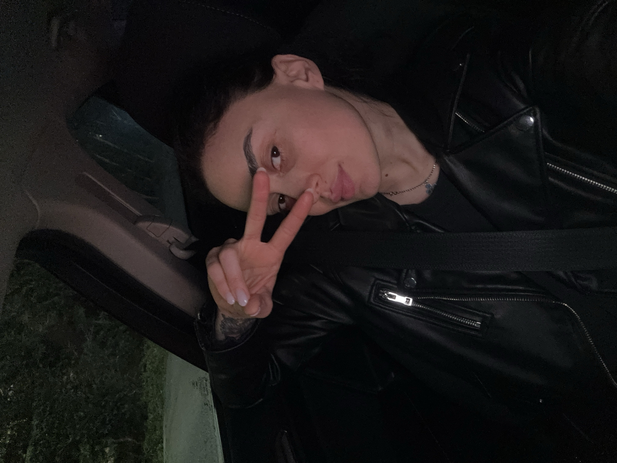 Nighttime car journey documented through selfies and street scenes in Tbilisi