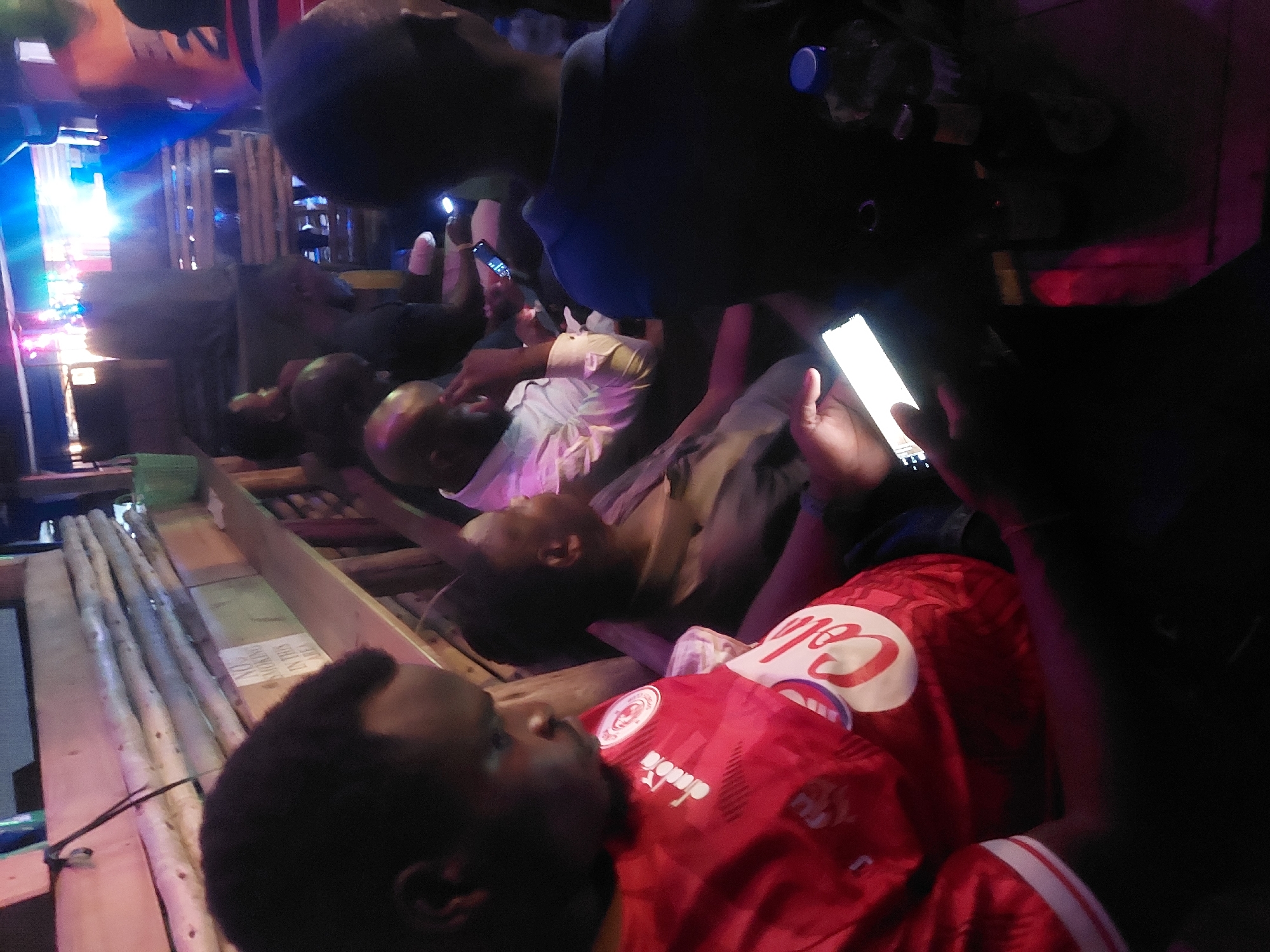 Evening social gathering documented at outdoor venue in Dar es-Salaam