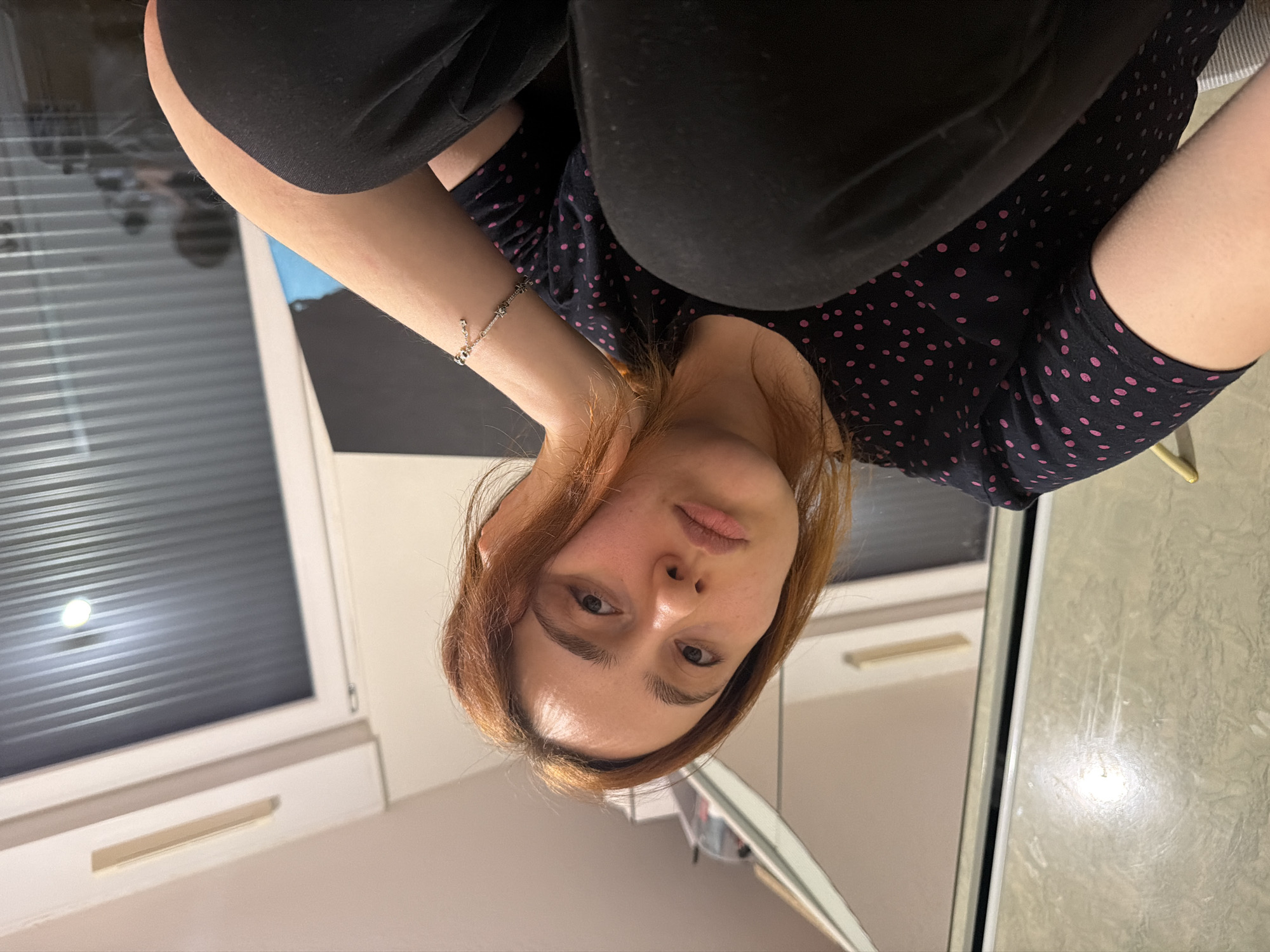 Woman takes selfies indoors in Strasbourg apartment