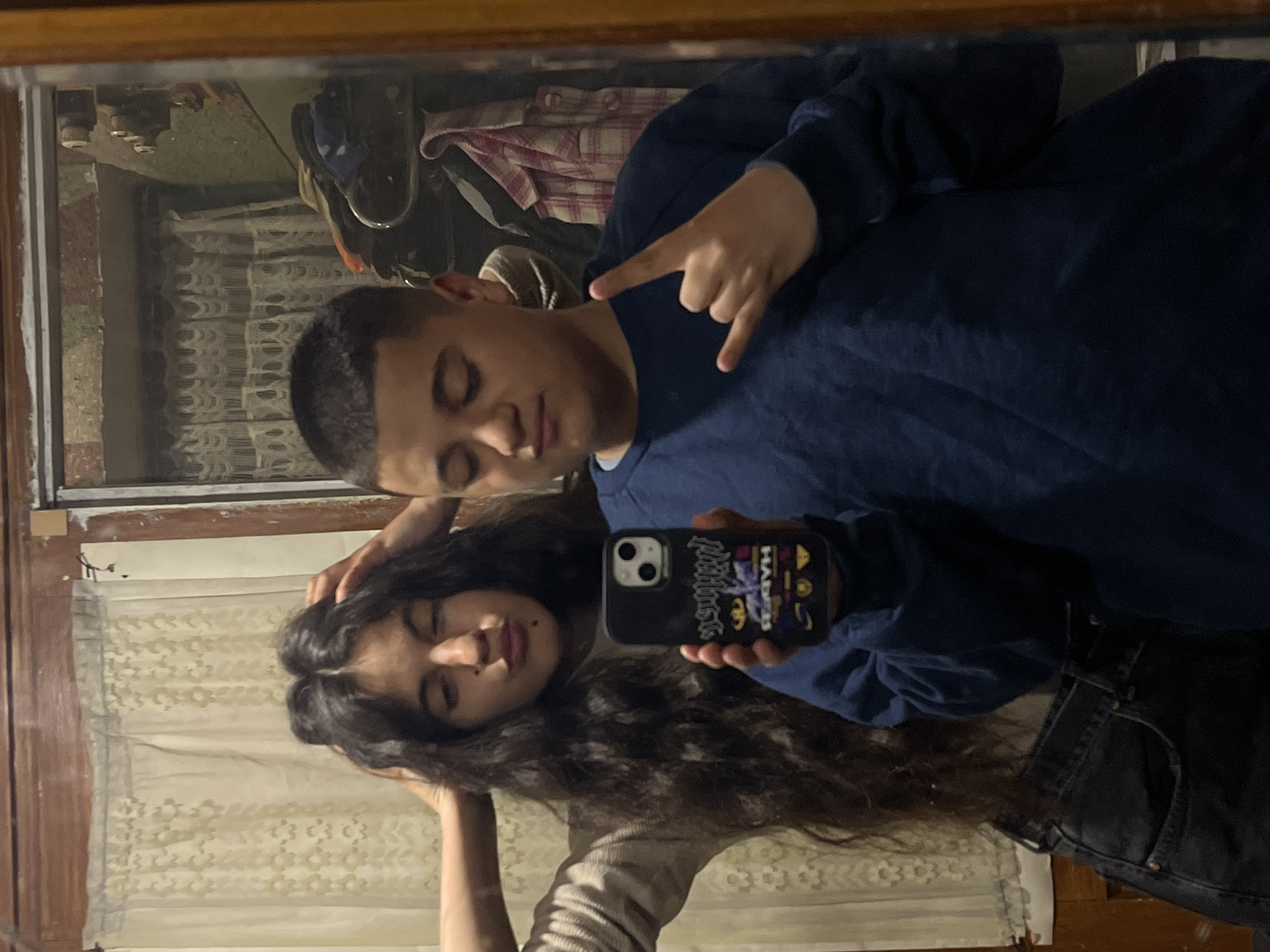 Young couple takes playful mirror selfies in Bulgarian town