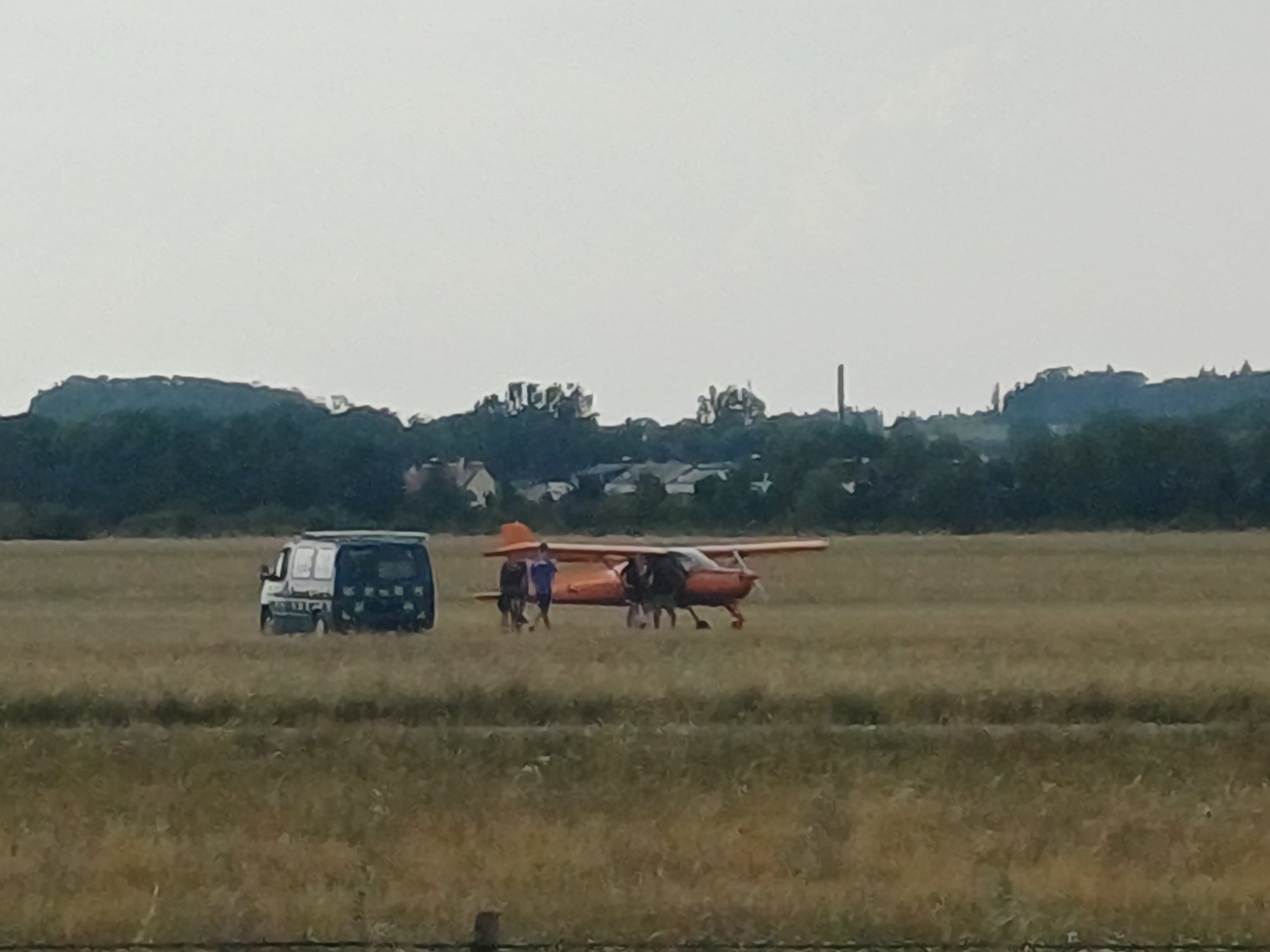 Sun-baked grass at a small airfield in Wels, Austria