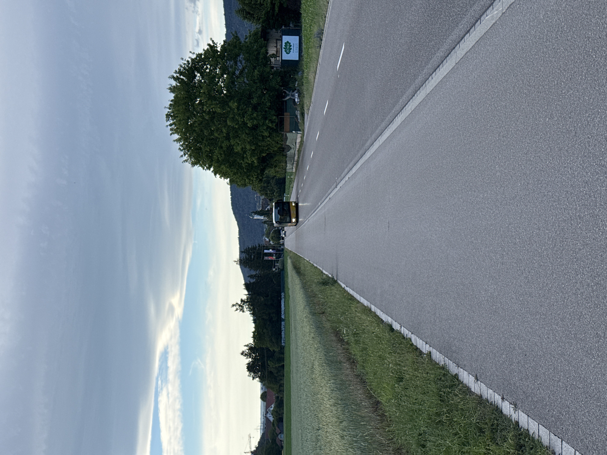 Rural Swiss countryside scenes with bus and parked car