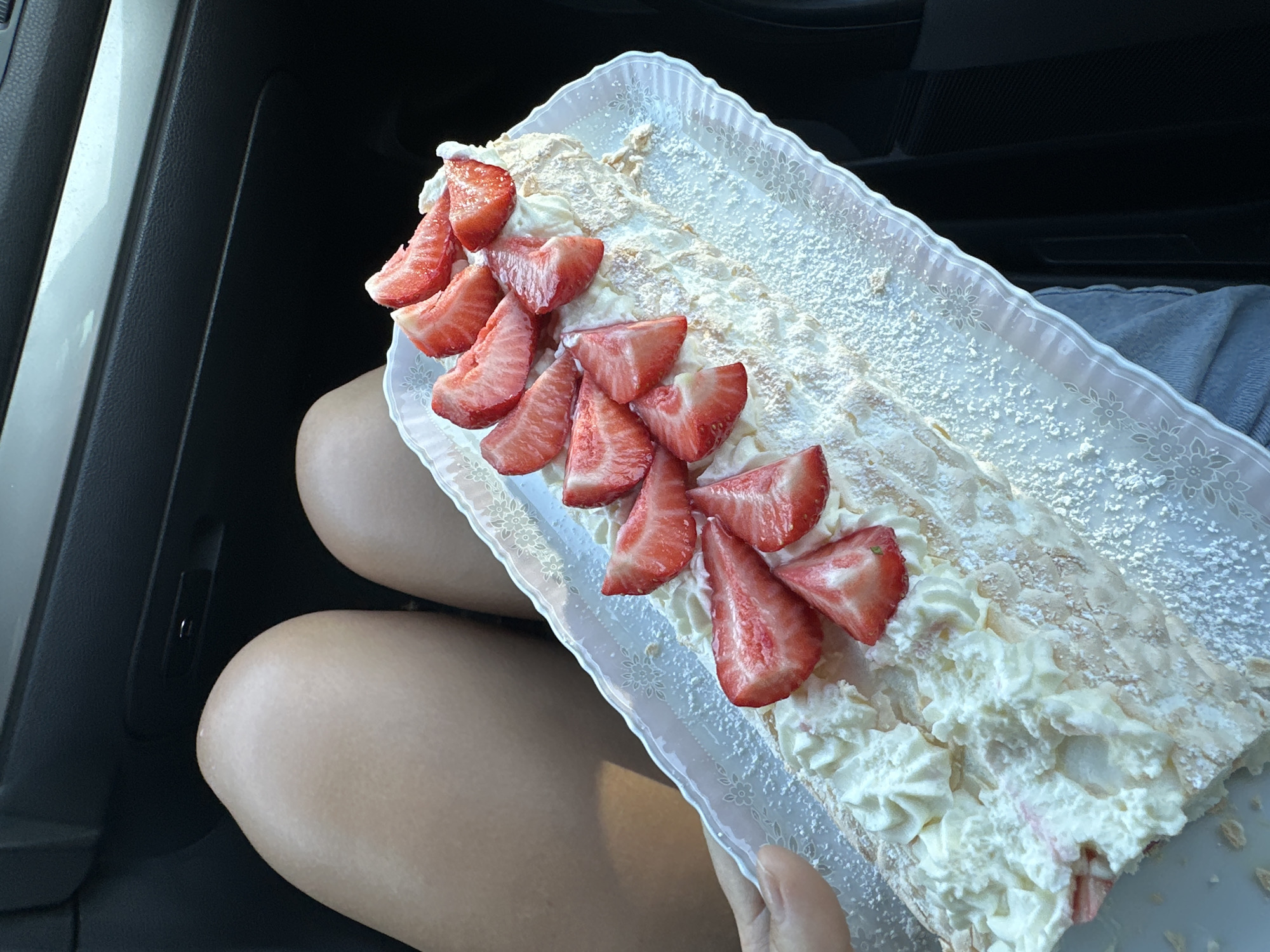 Cake and building photographed moments apart in Kutenholz