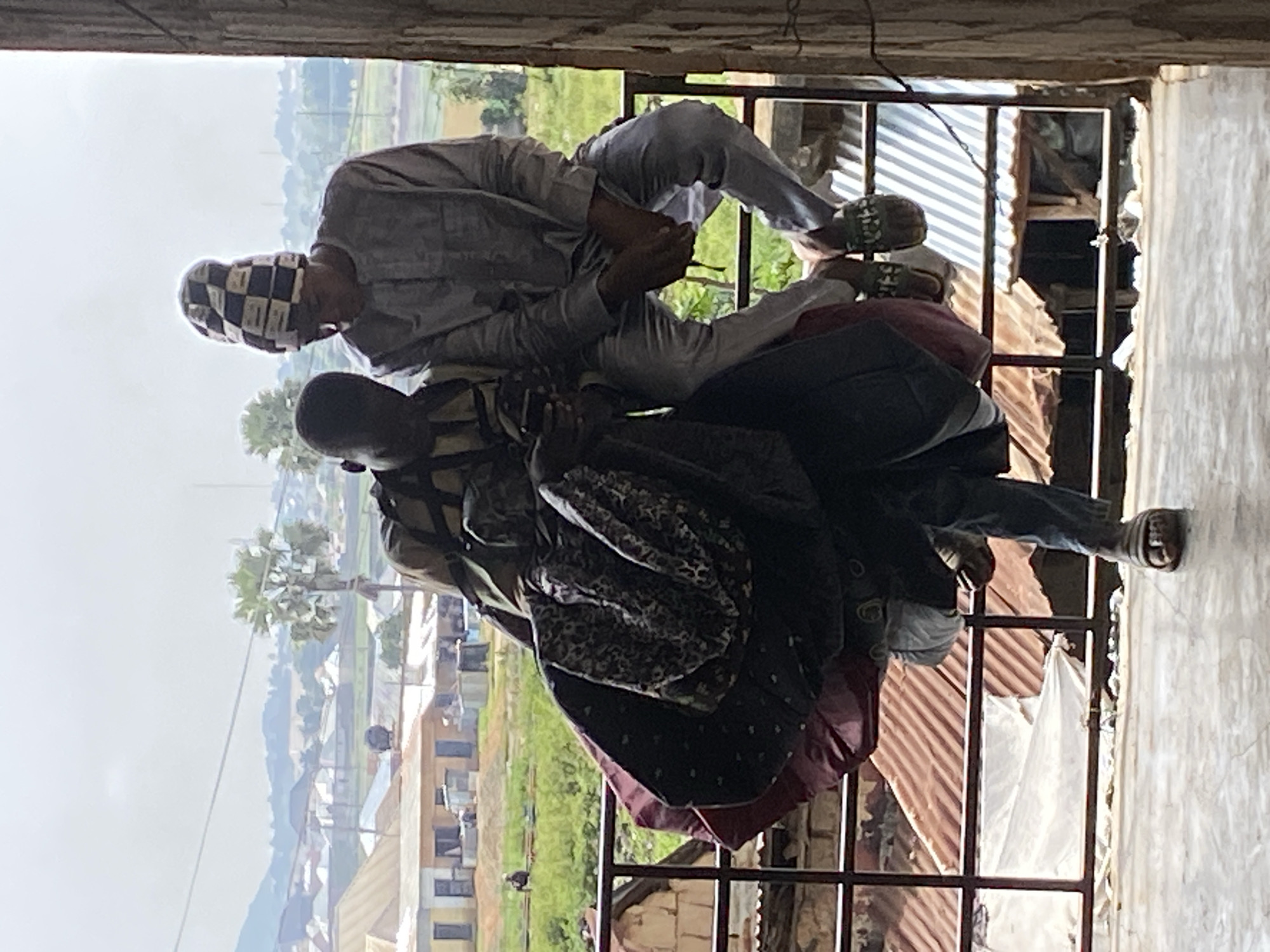 Bukuru street life: markets, traffic, and workers on a busy morning