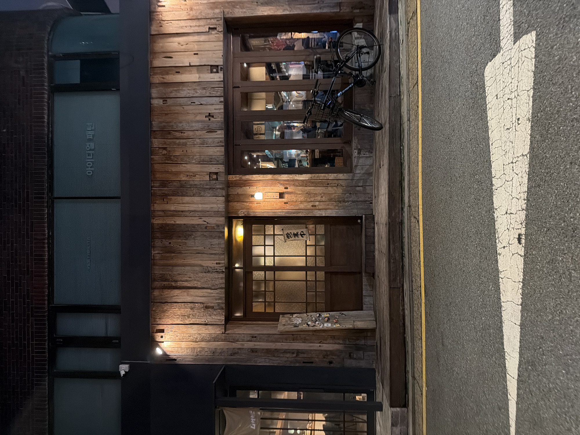 Rustic wooden shopfront spotted on a Seoul night street