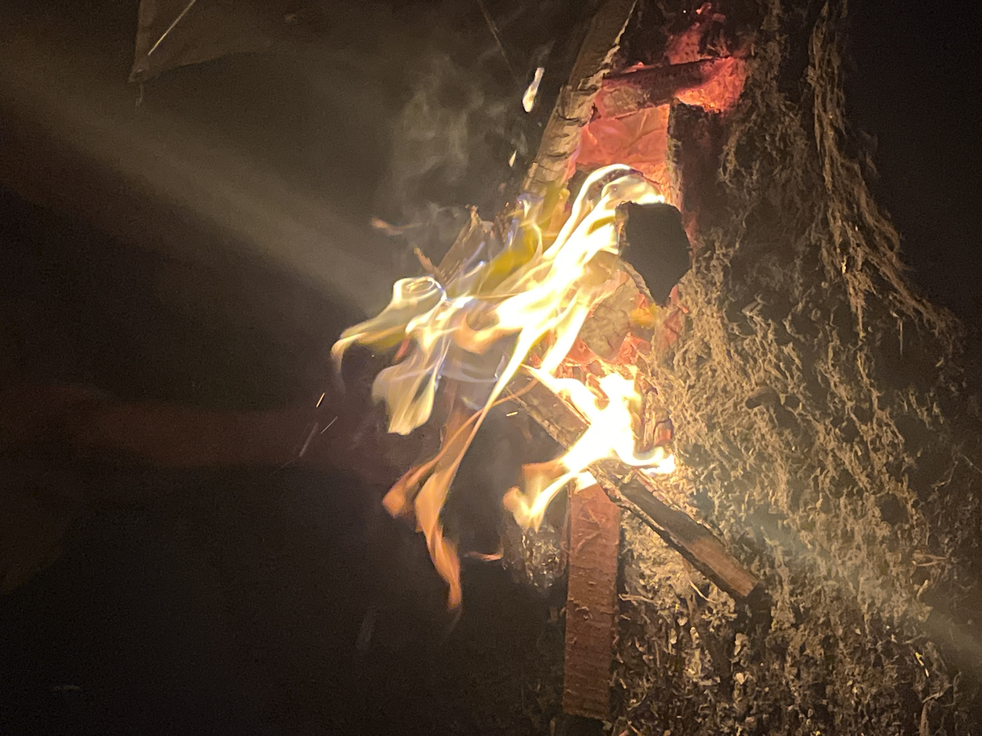 Night camping in Bali's hills — fire, fog, and a hot pot