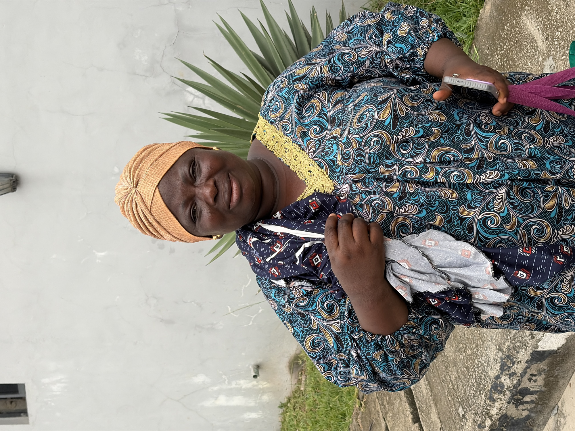 Woman photographed smiling outdoors in Igboefon, Nigeria