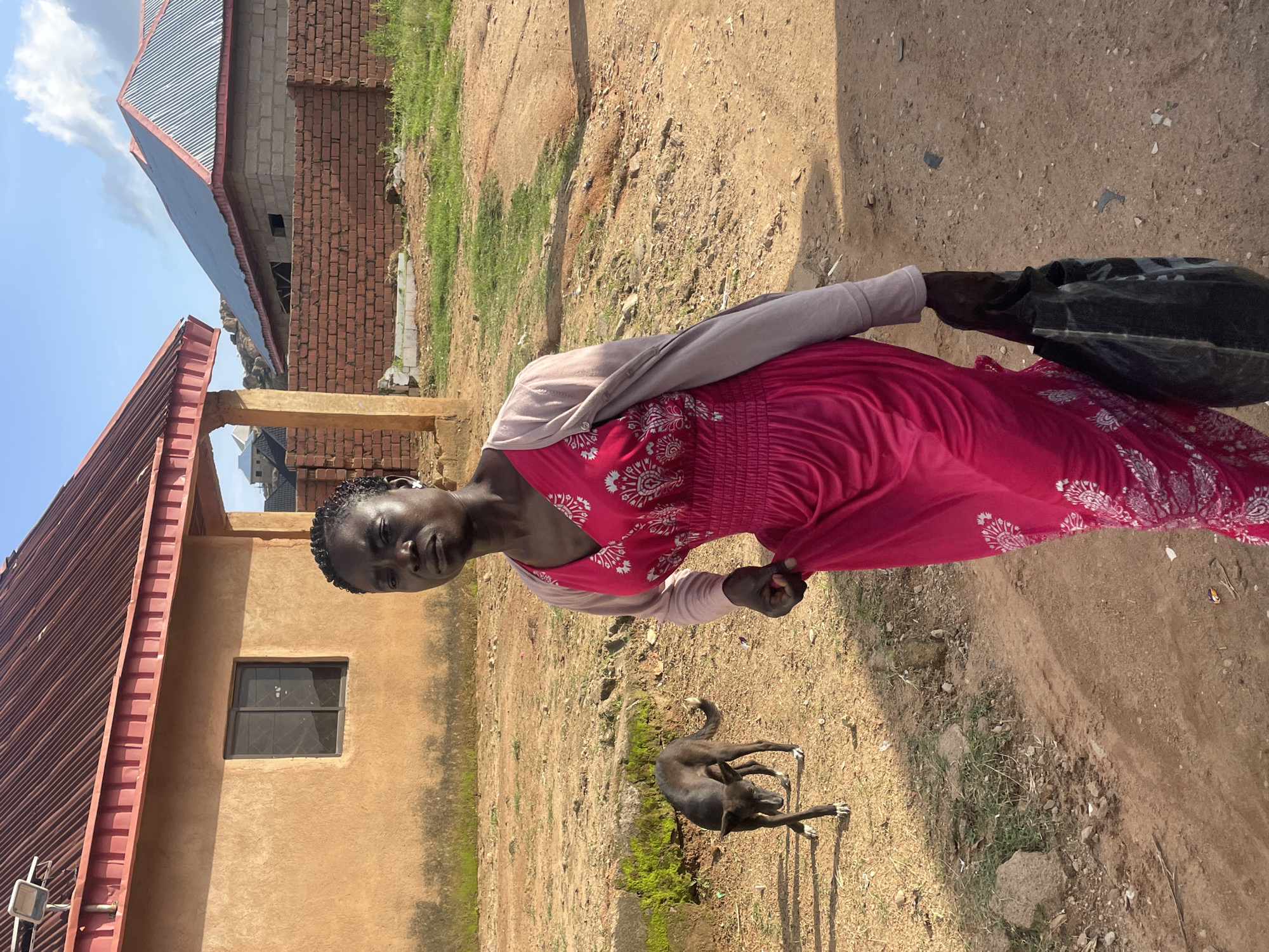 Afternoon foot traffic on the dirt roads of Jos, Nigeria