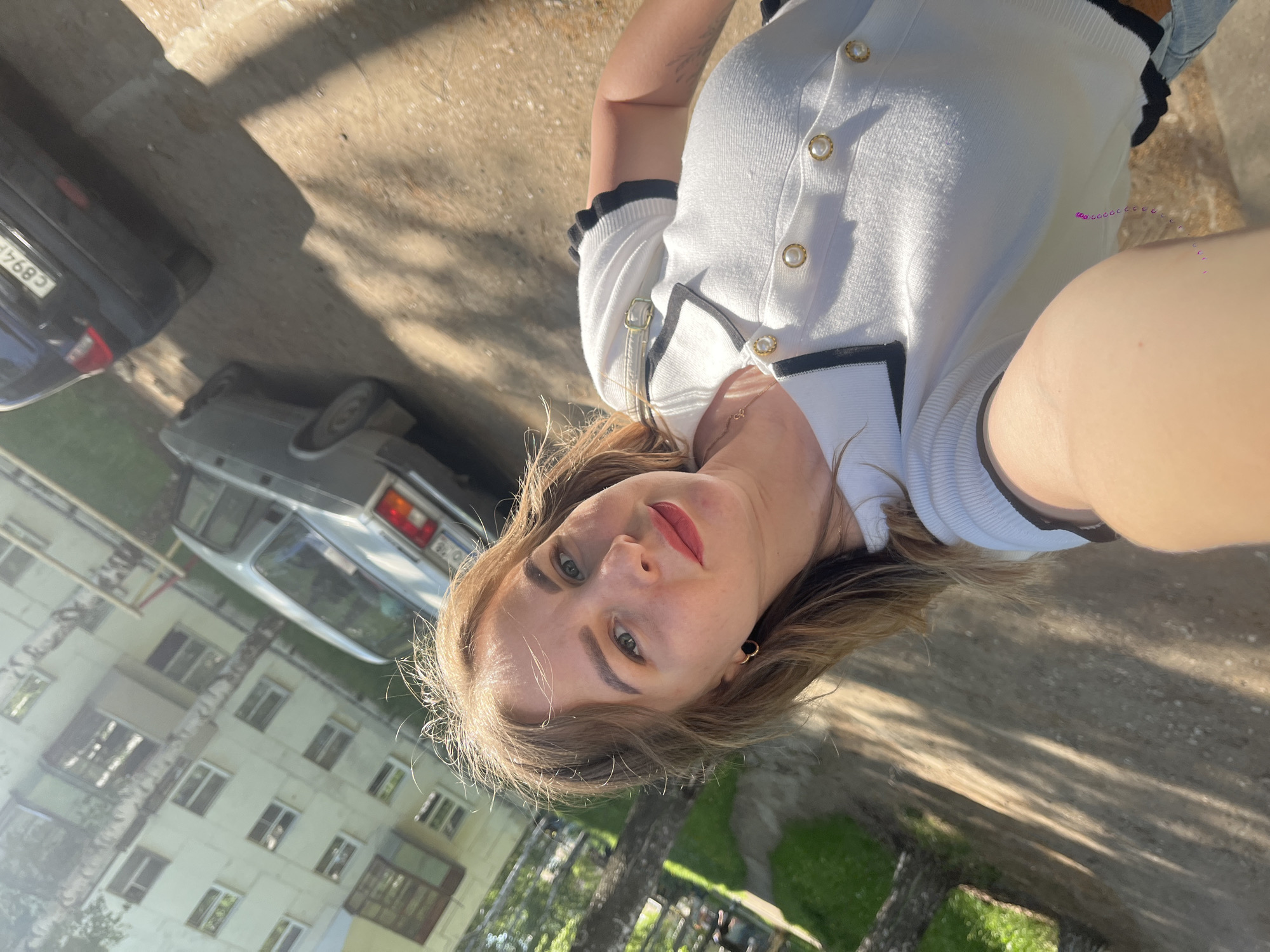 Woman photographs herself among birch trees in Izhevsk morning session