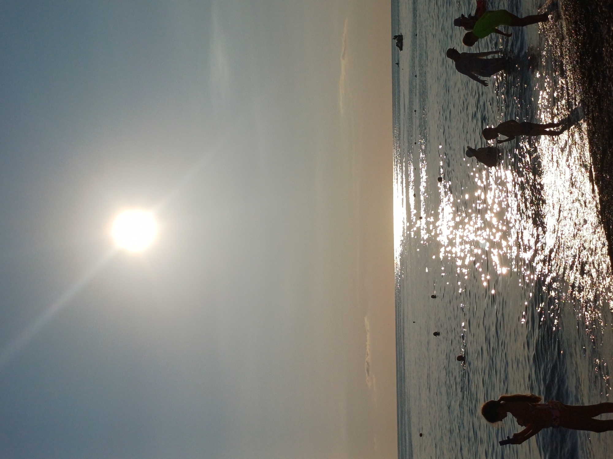 Afternoon at a Sochi Black Sea beach, paddleboarding and swimming