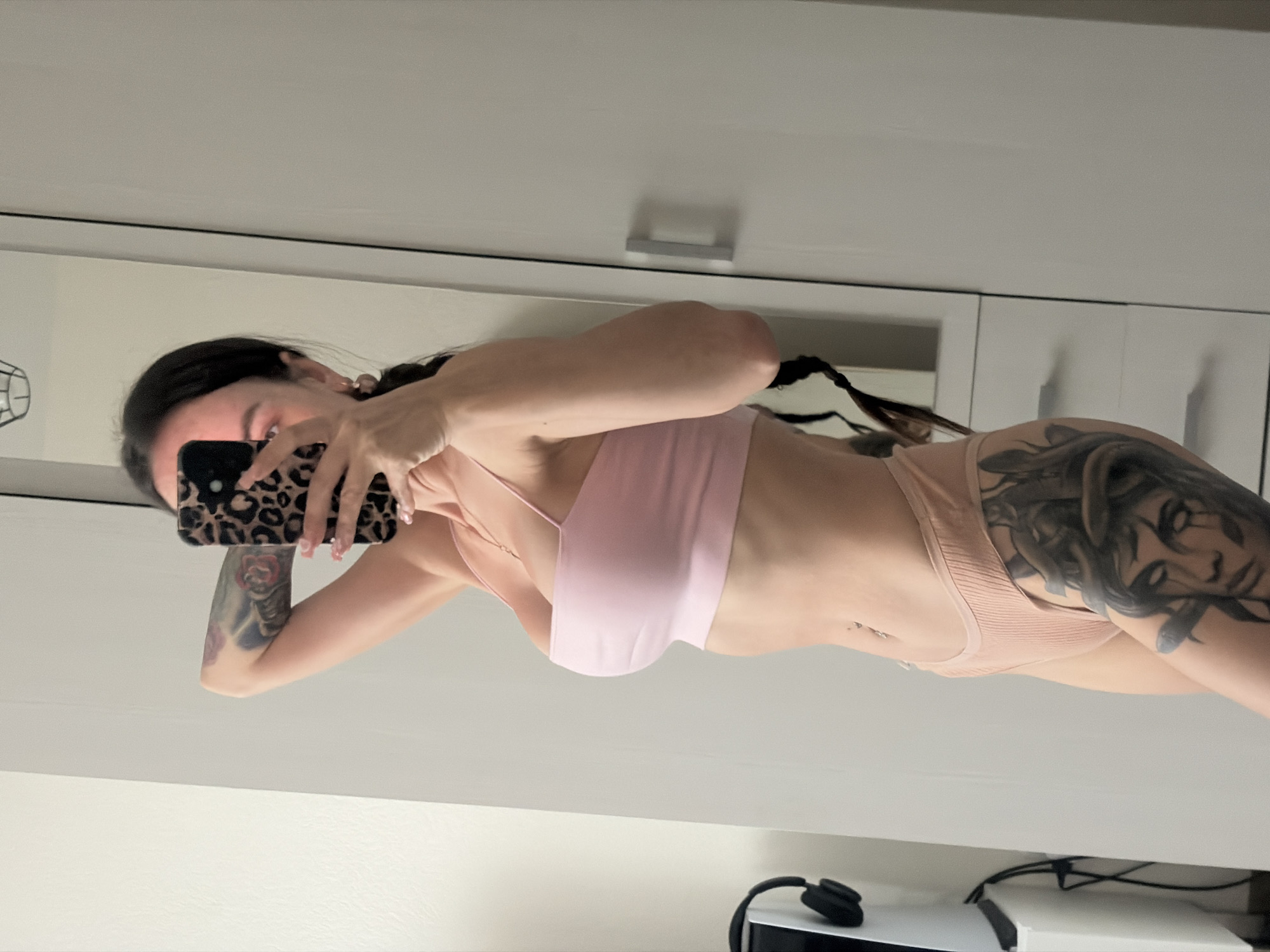 Woman takes mirror selfies with cat in Novosaratovka home