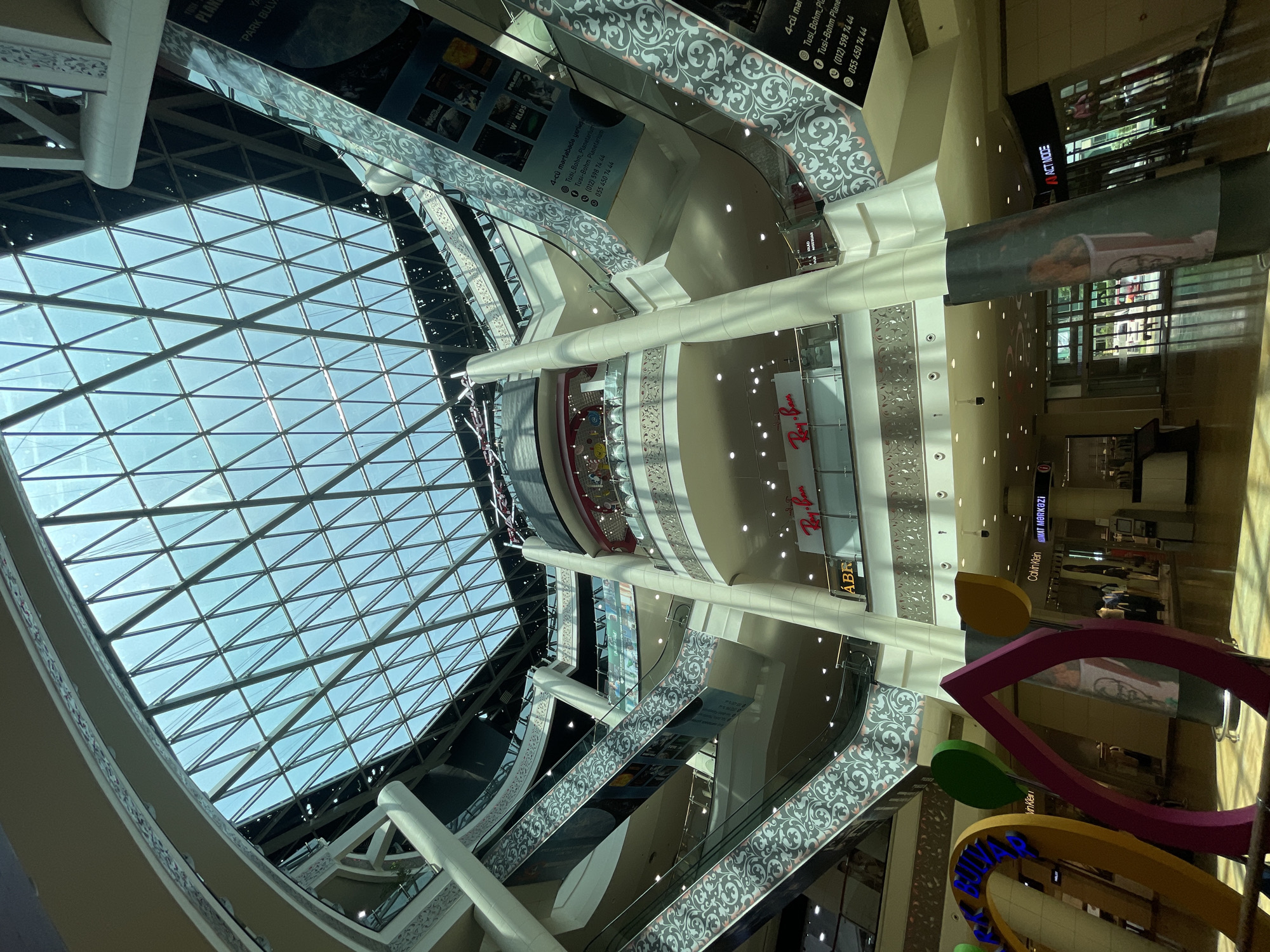 Glass-ceilinged Baku mall with bold abstract art installation