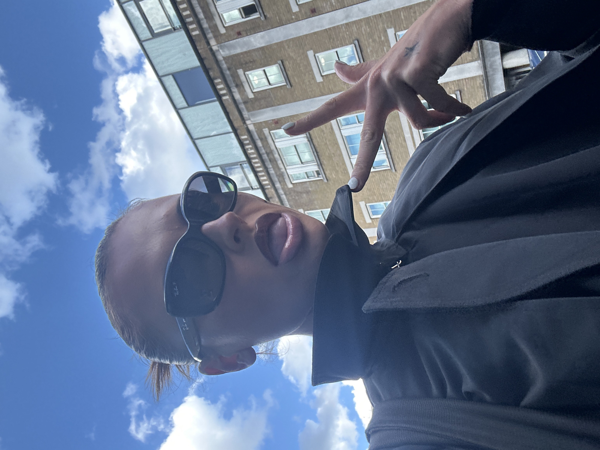 Woman Takes Playful Selfie in London