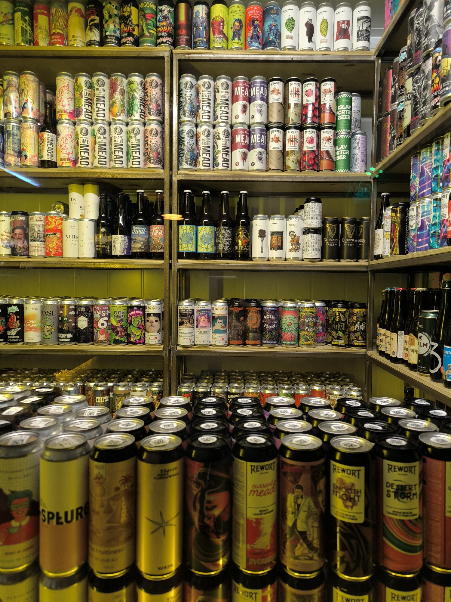 Beer shelves, chalk art, and a mural at a Rostov venue