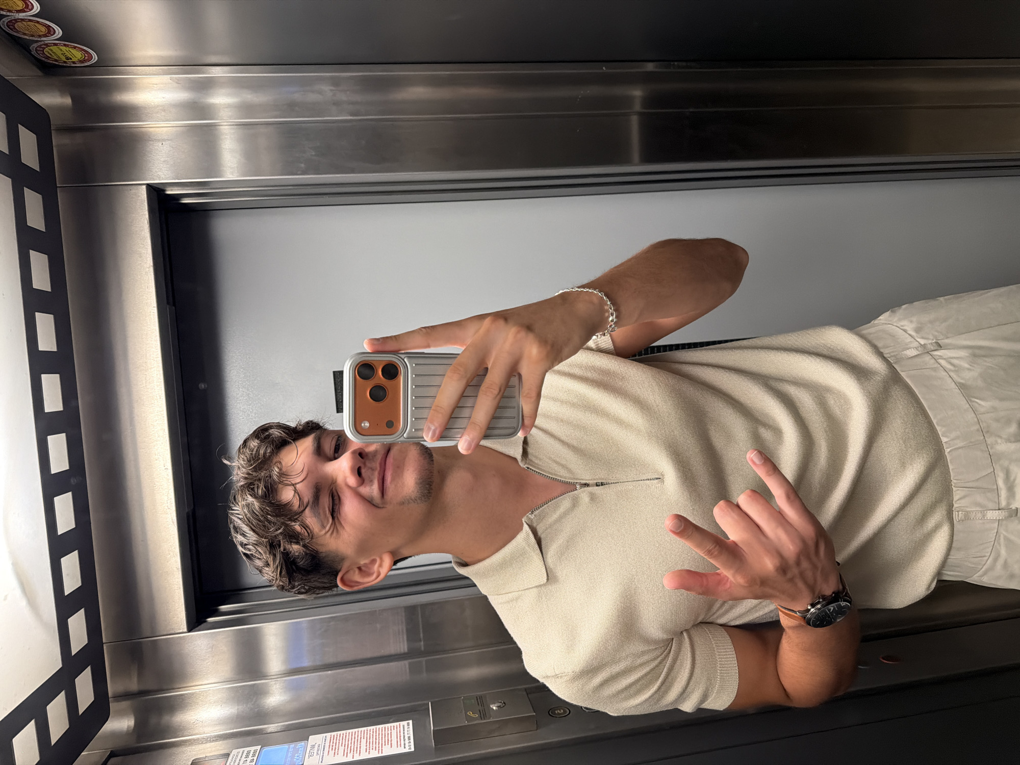 Elevator mirror selfie with a wink in Blagoevgrad