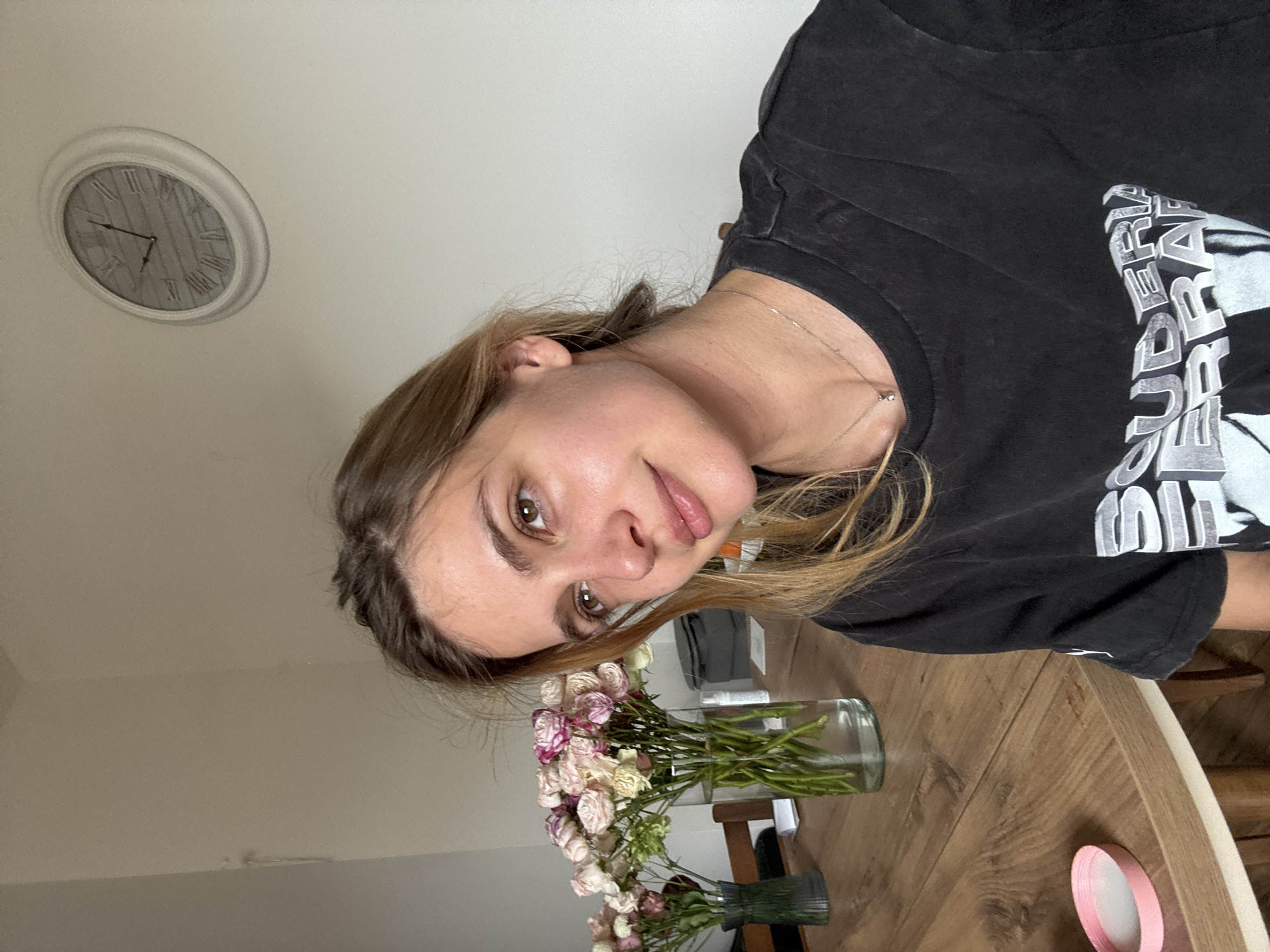 Woman applies skincare patch in home setting Saturday morning