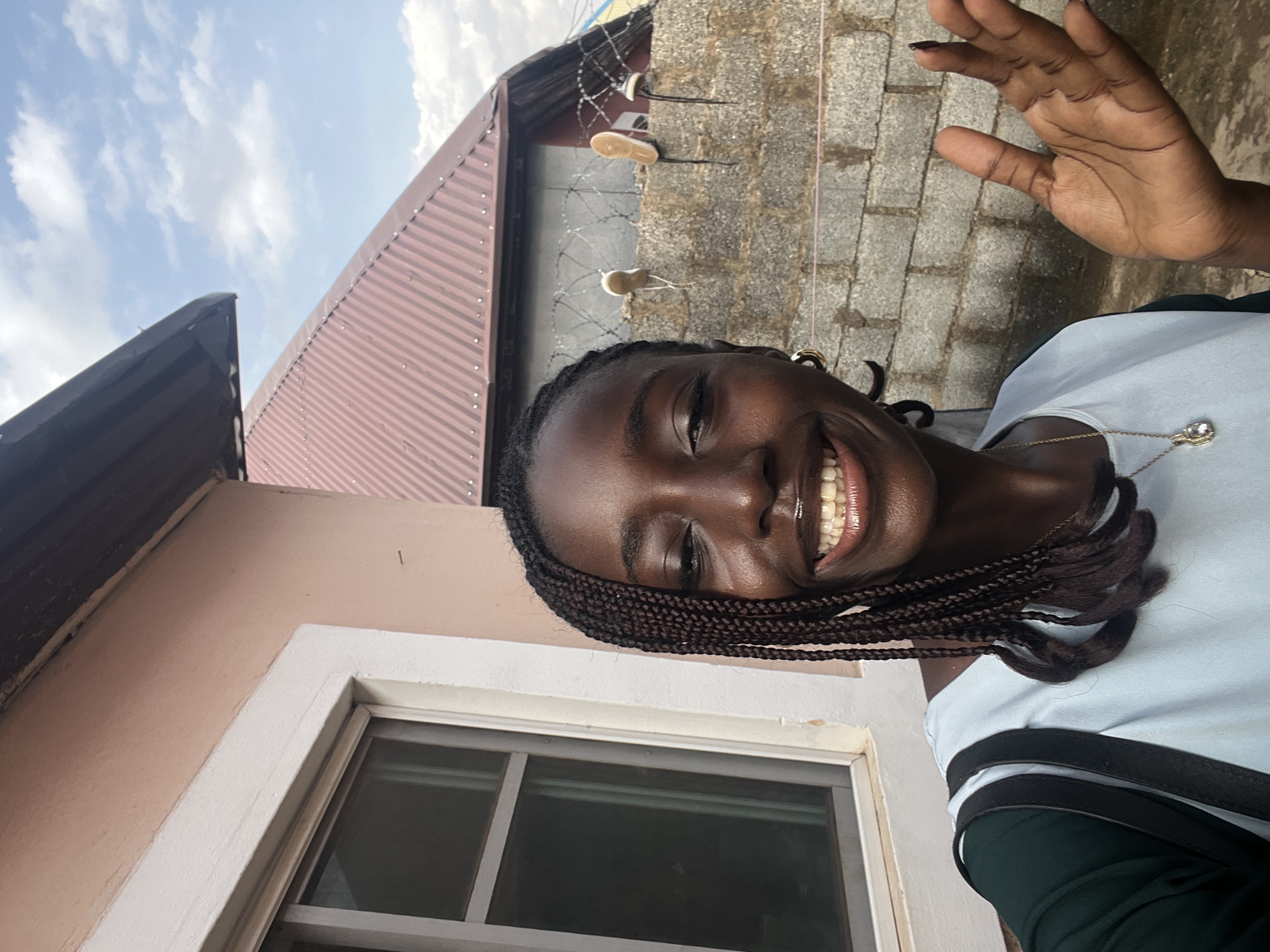 Woman takes selfie photo session in Abuja residential area