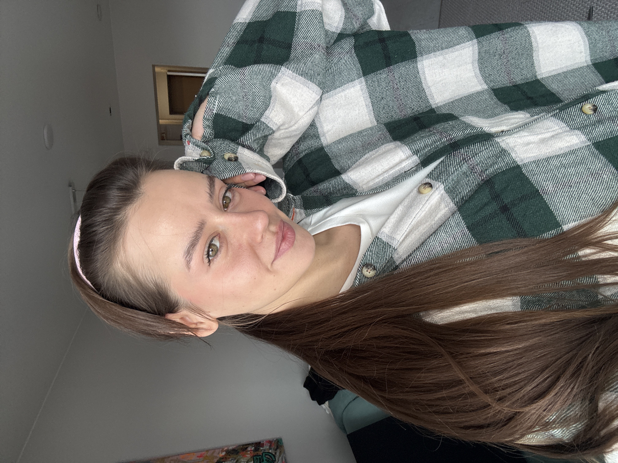 Woman takes morning selfie in Krasnoyarsk apartment