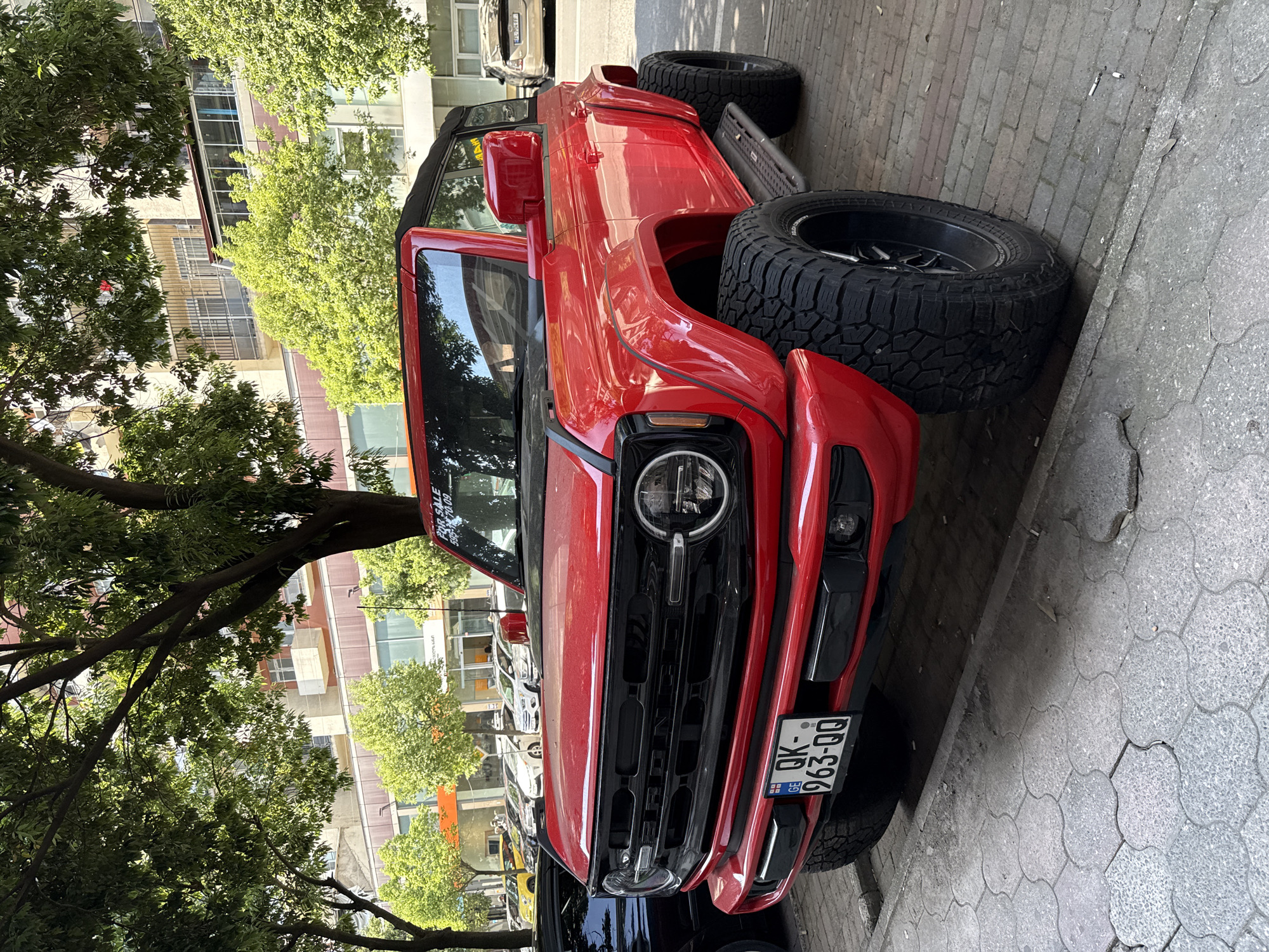 Trucks parked near Legacy store, fresh berry stall close by