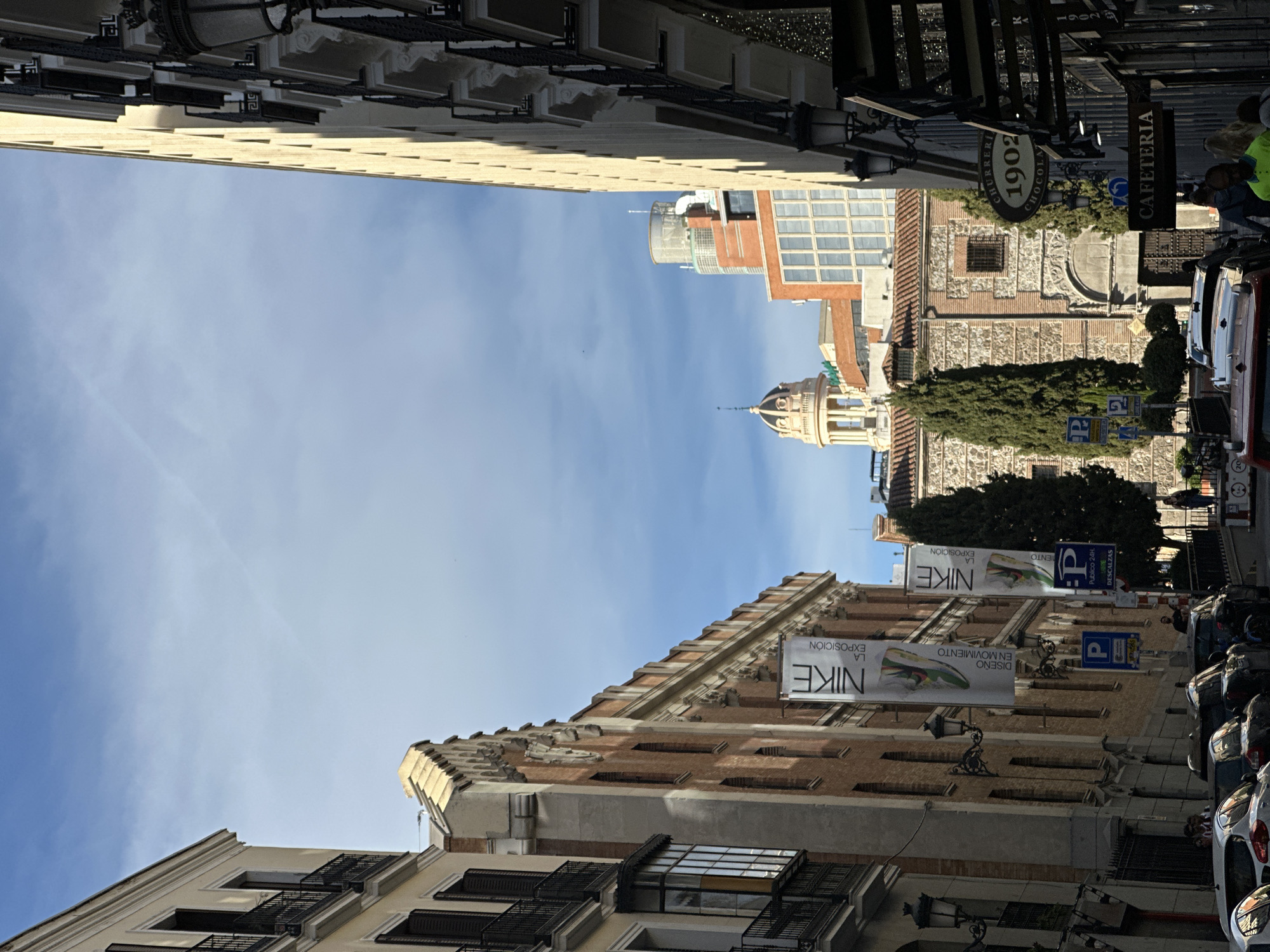 Madrid street scenes with Nike exhibition and bougainvillea canopy