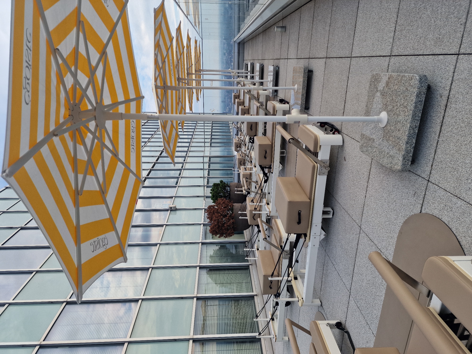 Rooftop Pilates setup and aerial city view, Düsseldorf