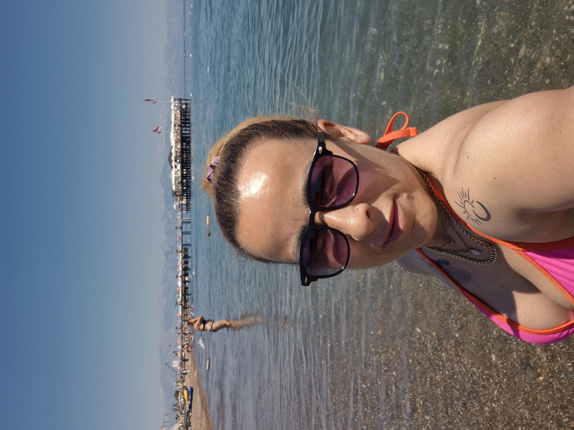 Sunny beach day with selfies, loungers, and shoreline scenes