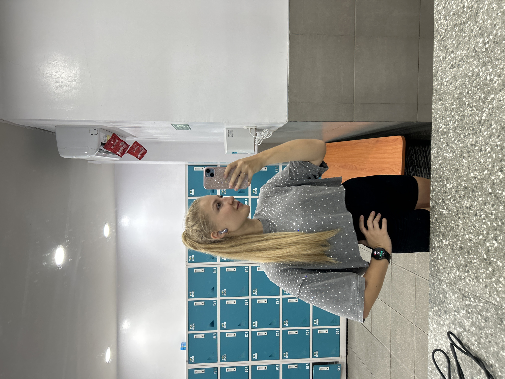 Woman takes selfie in Kuta Selatan locker room